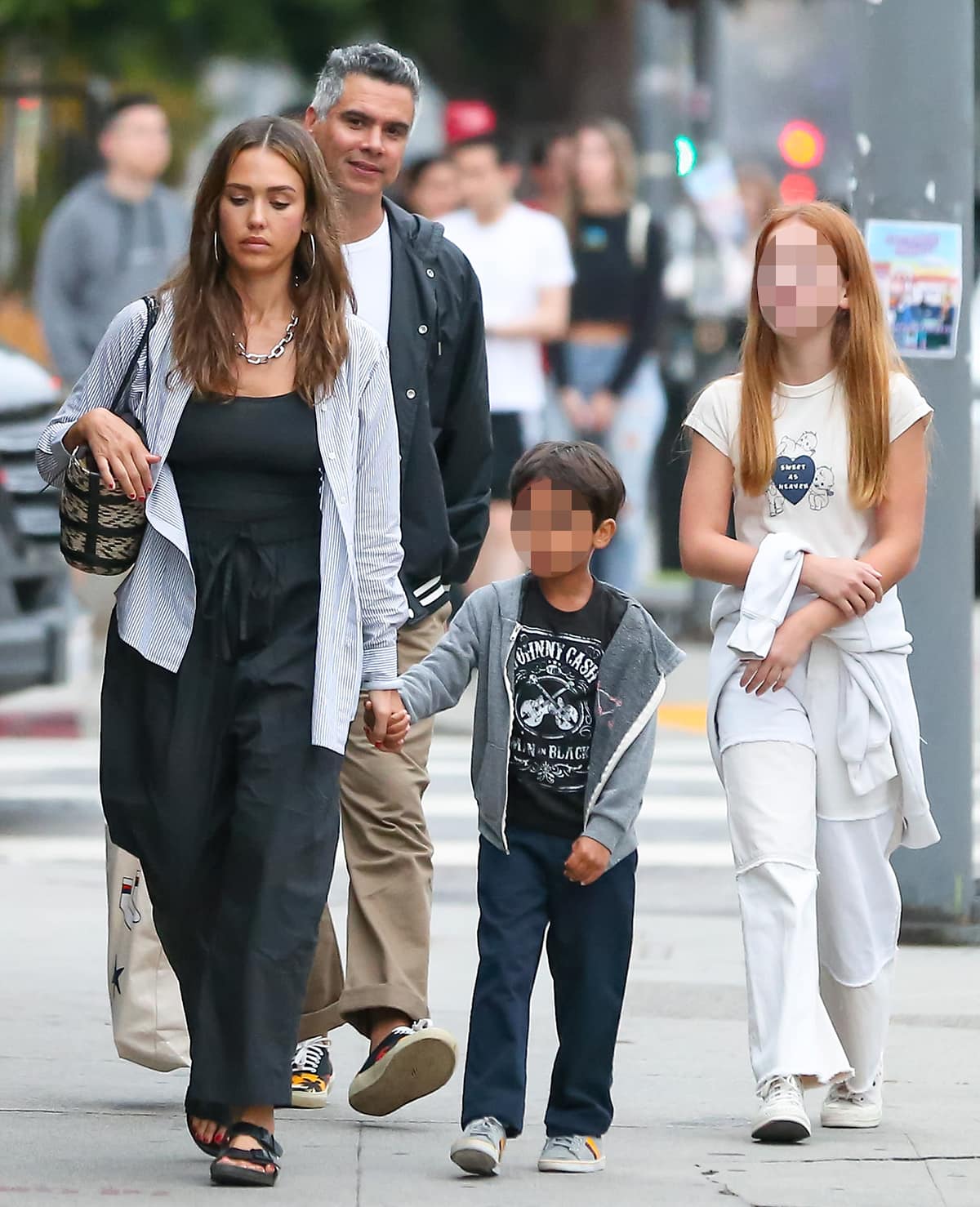 Jessica Alba's kids and husband also dressed casually for their dinner outing, all wearing sneakers and hoodies