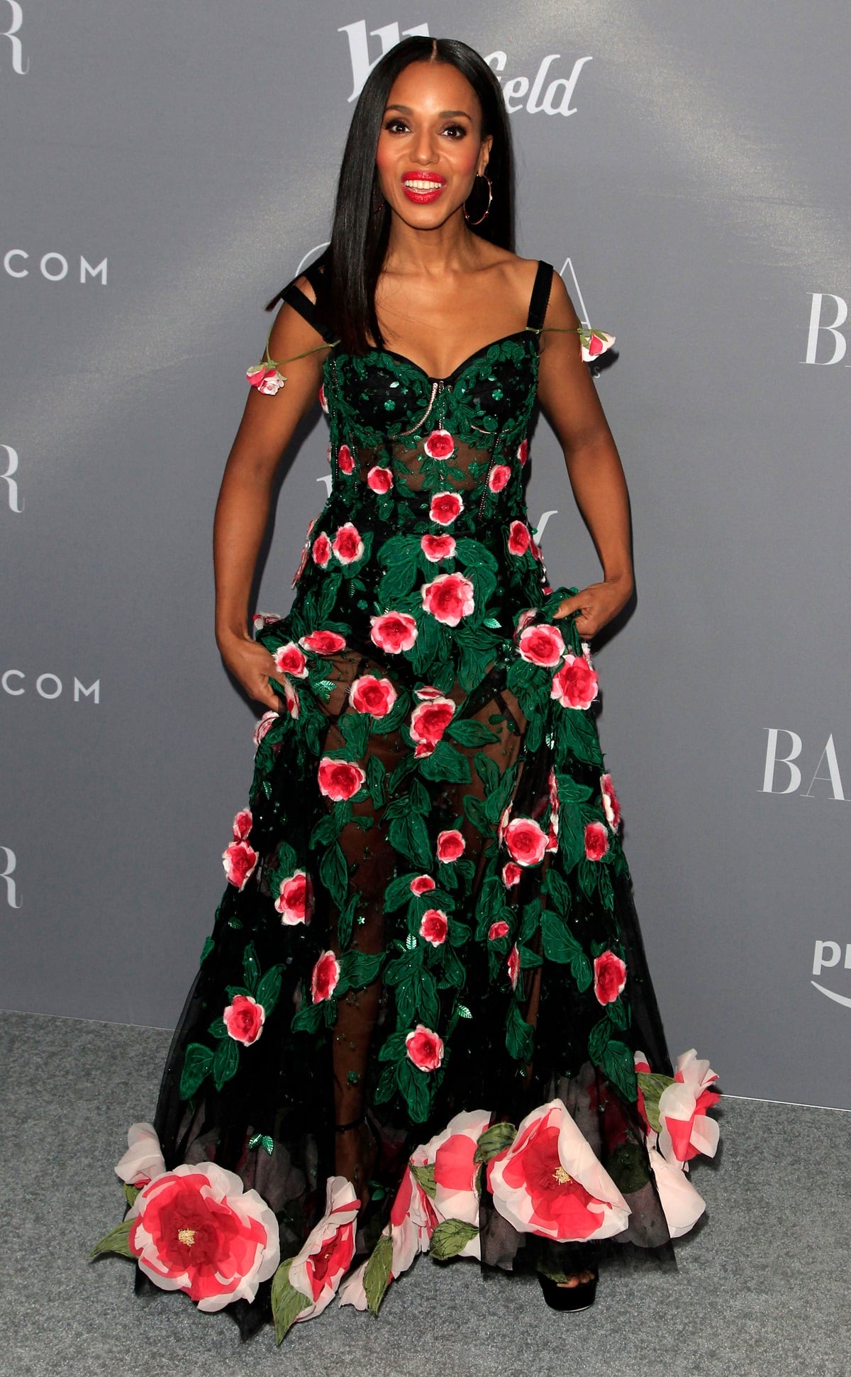 Kerry Washington received the 'Spotlight Award' at the Costume Designers Guild Awards, looking mesmerizing in a black floral appliqué gown from Dolce & Gabbana's Spring 2018 collection, complemented by gold accents and a bold red lip