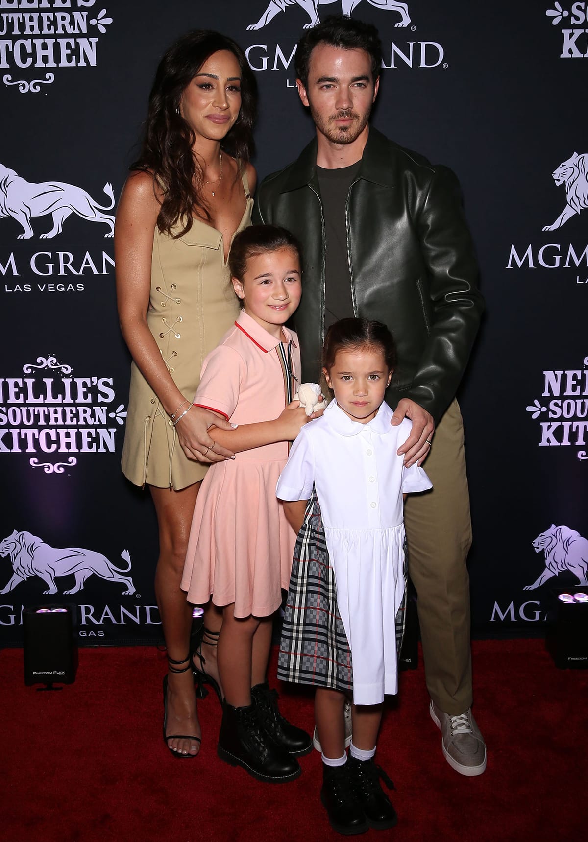 Danielle Jonas with her husband Kevin Jonas and their kids Alena Rose and Valentina Angelina at the Grand Opening Party For Nellie’s Southern Kitchen in 2022