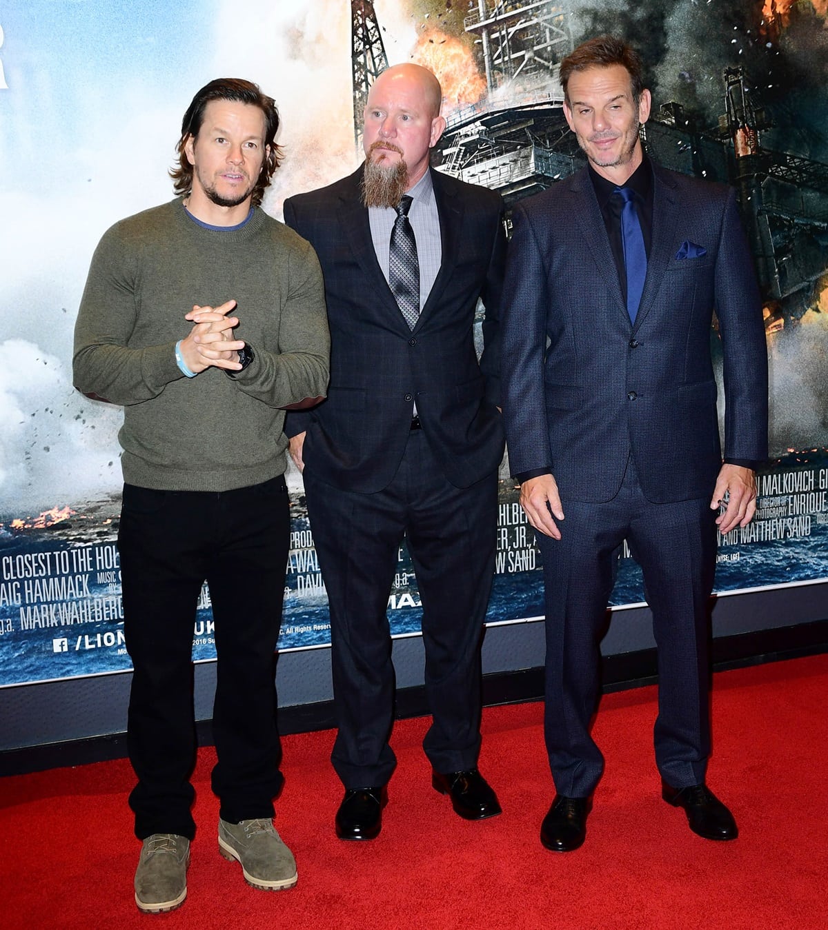 Mark Wahlberg poses with real-life Deepwater Horizon survivor Mike Williams and director Peter Berg at the European Premiere of "Deepwater Horizon"