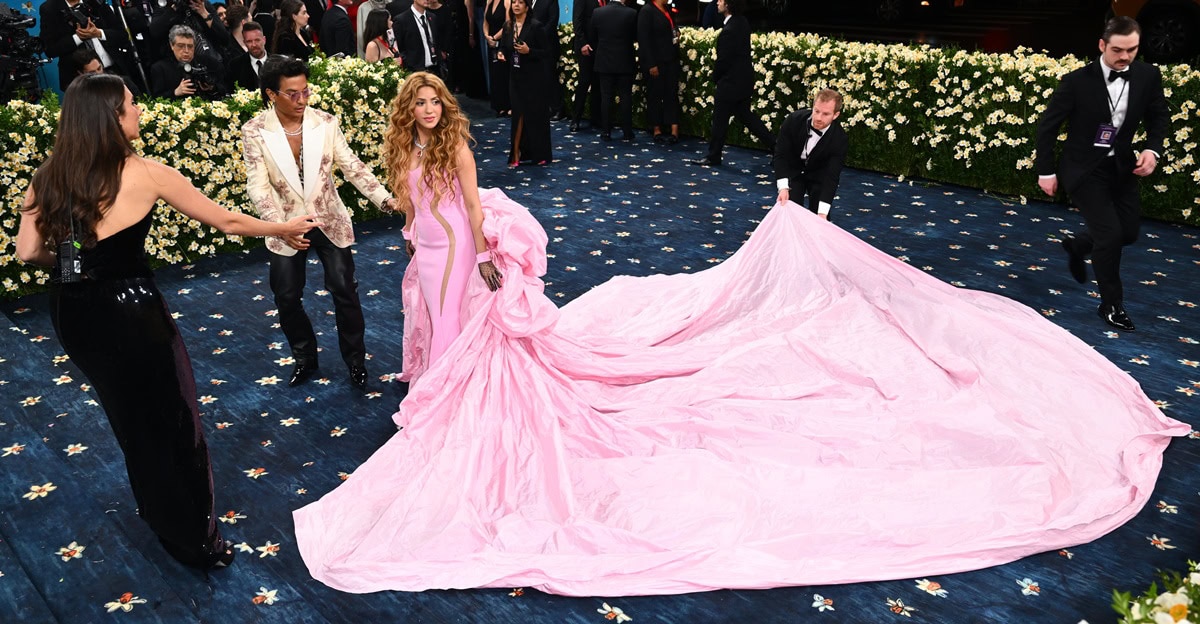 Shakira stuns at the 2025 Met Gala in a custom Prabal Gurung pink gown featuring dramatic side cutouts and a sweeping train, styled with sheer gloves and gemstone accessories