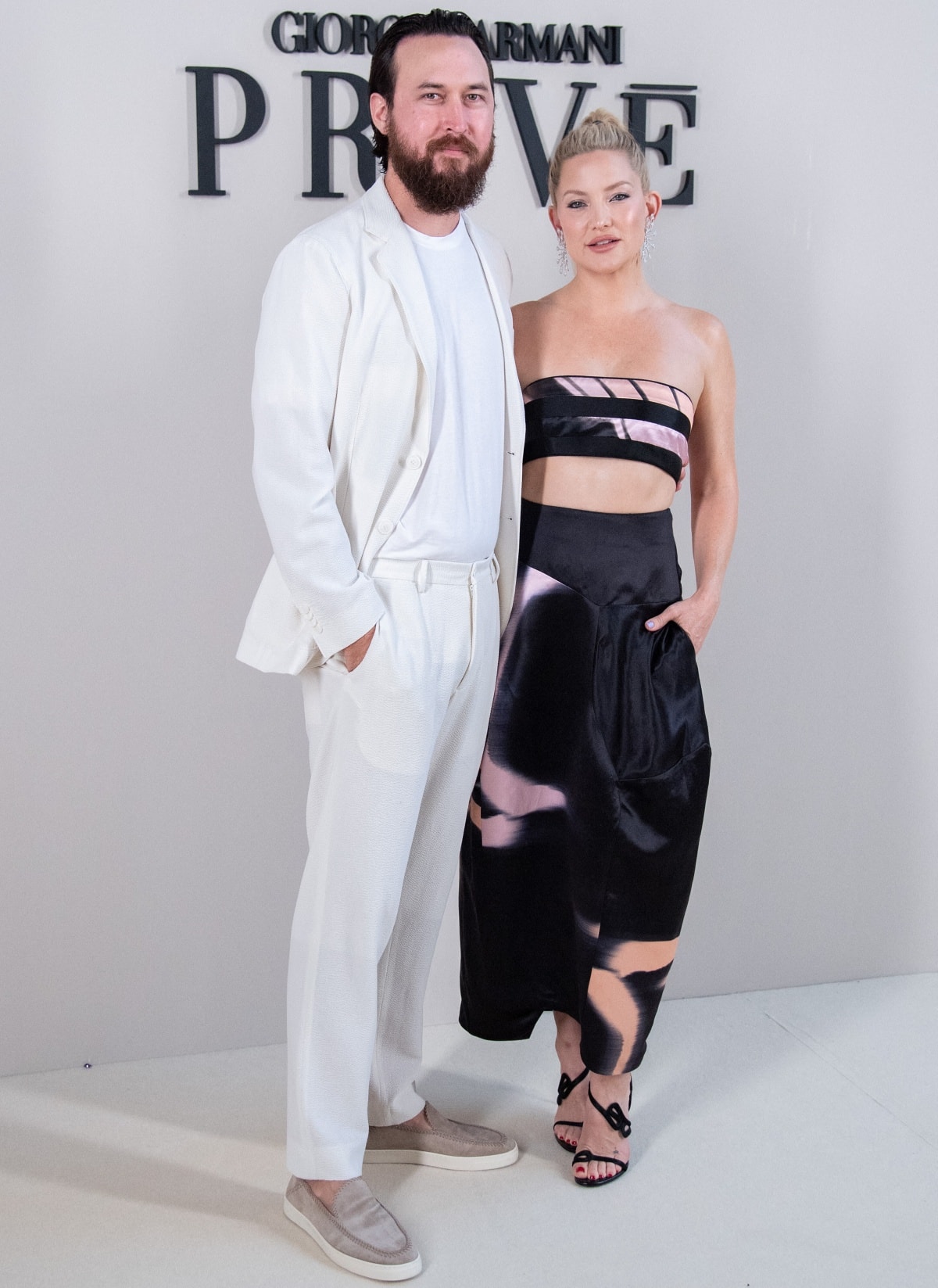 Danny Fujikawa joining his fiancée Kate Hudson in a monochromatic ensemble with gray velvet shoes