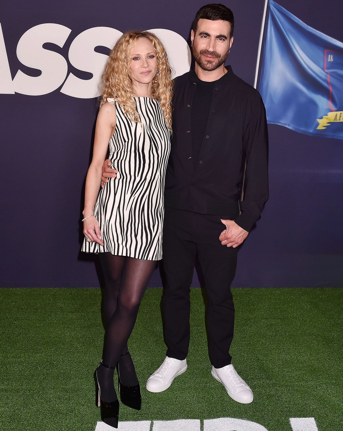 Ted Lasso co-star Juno Temple may be wearing high heels, but Brett Goldstein still towers over her at 5 feet and 11 inches