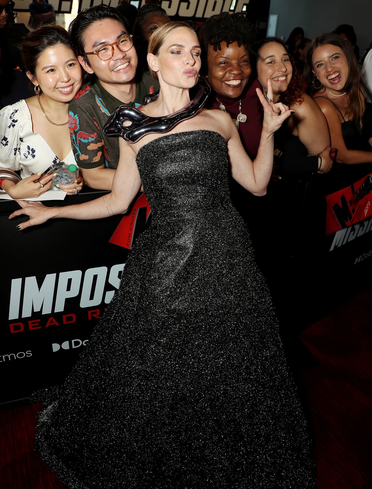 Rebecca Ferguson posing for photographs with fans at the New York premiere of Mission: Impossible – Dead Reckoning Part One