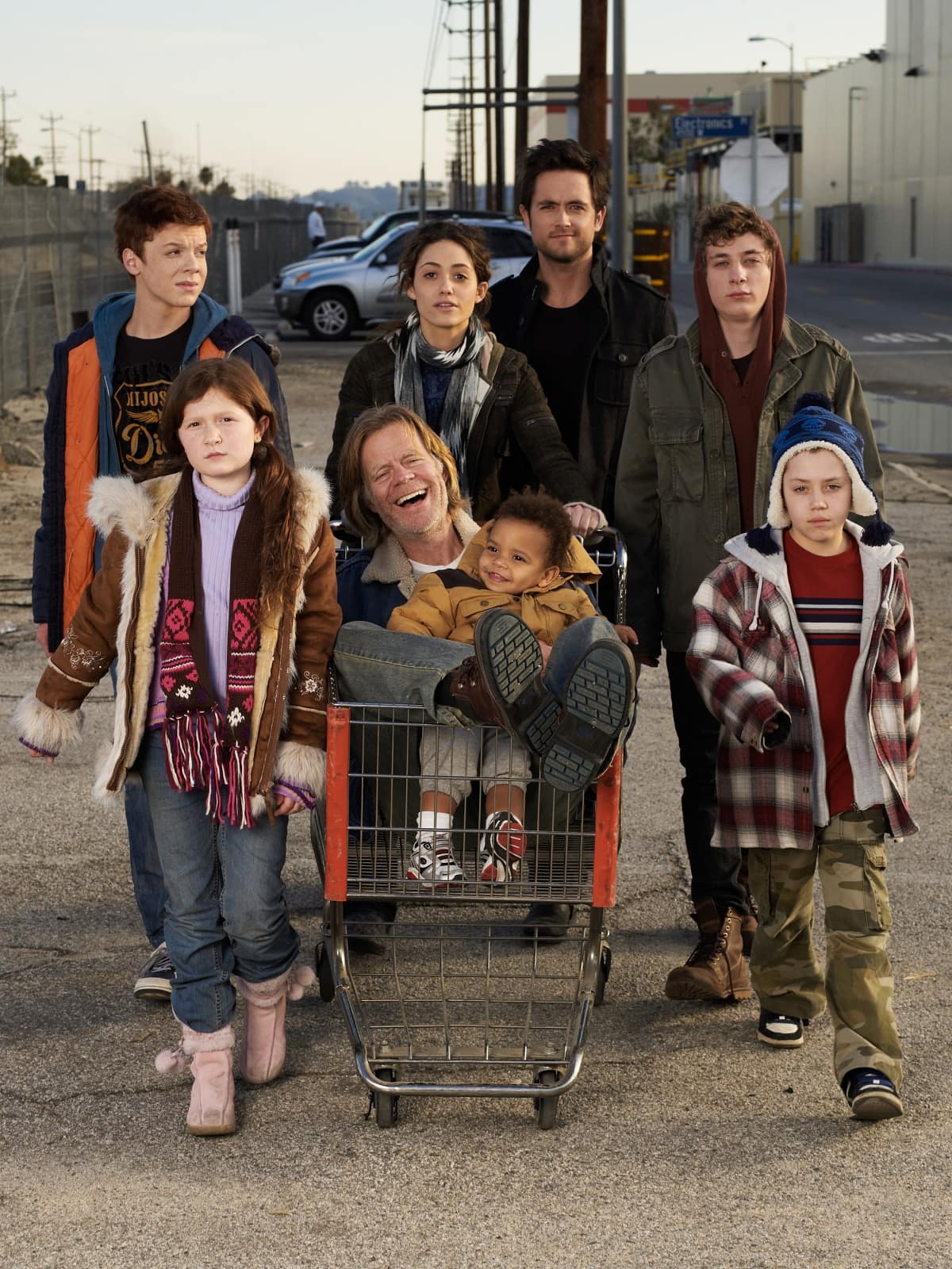 The Gallagher family in the American comedy-drama show Shameless is made up of Frank (William H. Macy), Fiona (Emmy Rossum), Lip (Jeremy Allen White), Ian (Cameron Monaghan), Debbie (Emma Kenney), Carl (Ethan Cutkosky), and Liam (Brenden Gleeson)
