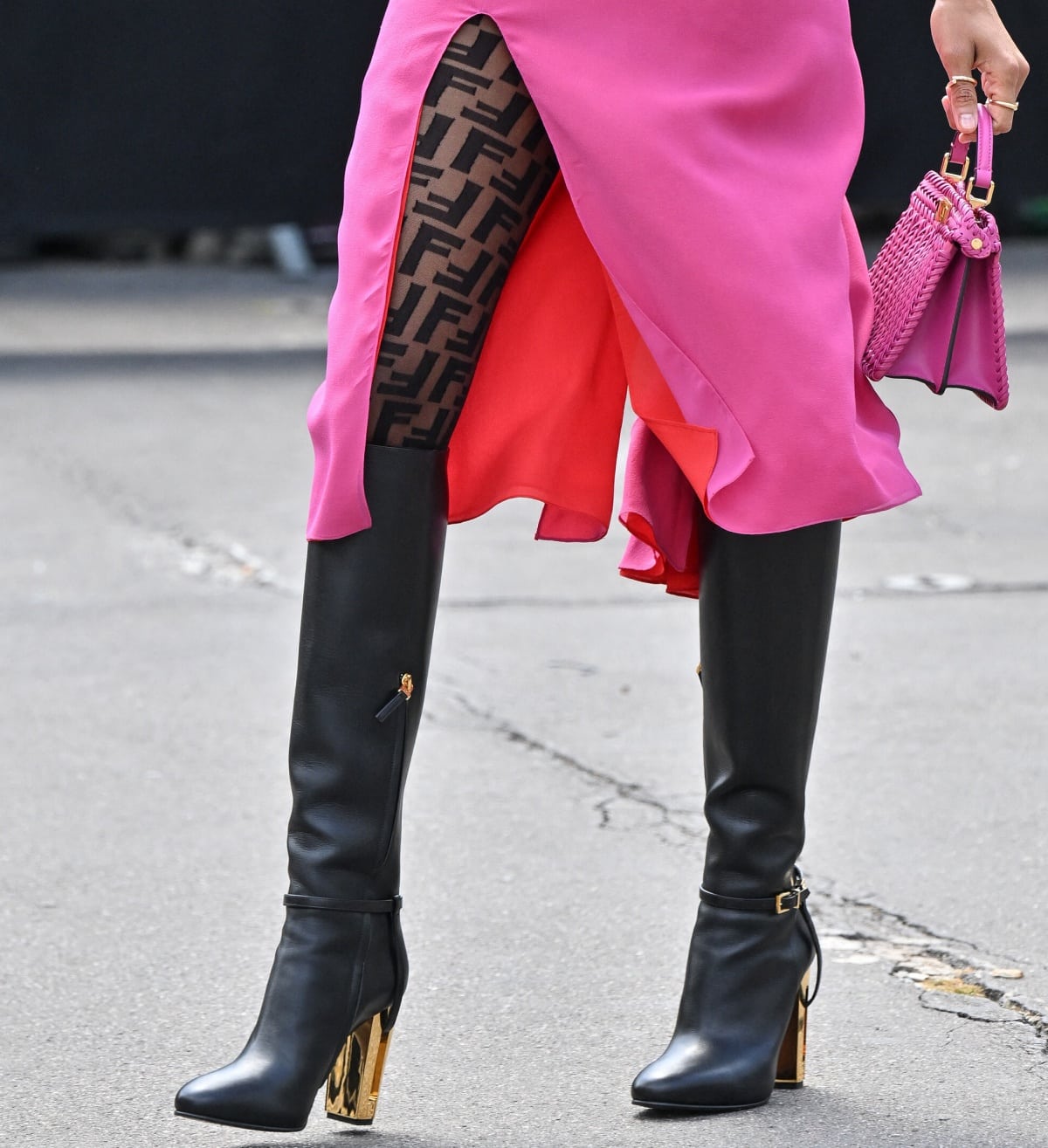 A closer look at Zoe Saldaña’s Fendi black knee-high boots styled with Fendi monogram stockings