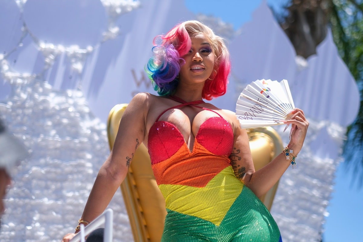 Cardi B enthusiastically participated in the WEHO Pride Parade, riding a float while distributing her Whipshots vodka-infused whipped cream to onlookers, all while donning a rainbow bodysuit and a colorful wig