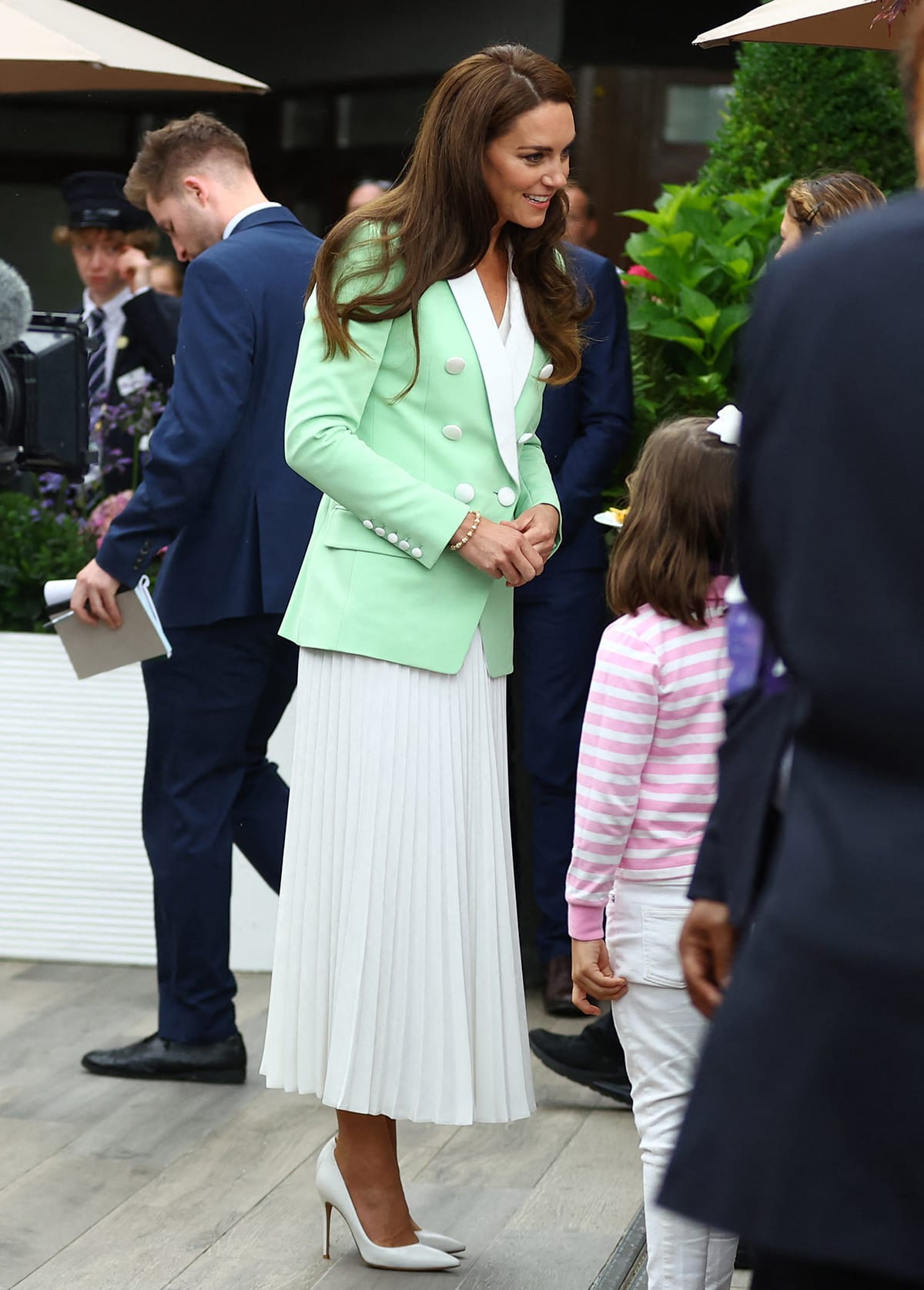 Kate Middleton attends day two of the 2023 Wimbledon Championships at the All England Lawn Tennis and Croquet Club in a Balmain mint green and white blazer and a white pleated dress on July 4, 2023