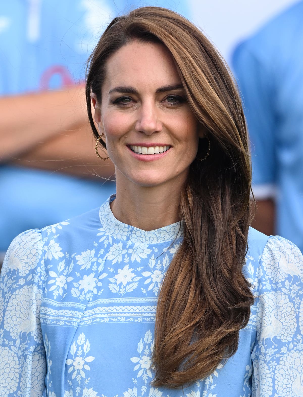 Kate Middleton styles her printed blue dress with Lenique Louis Spine Hoop Earrings and wears her tresses in side-parted loose waves