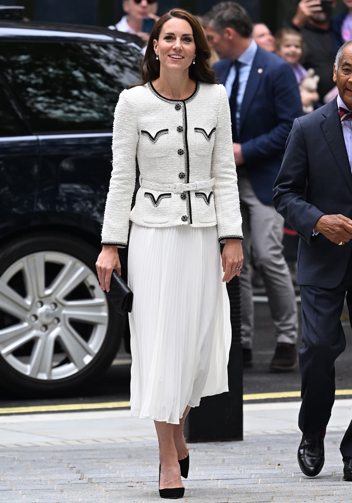 Kate Middleton is the definition of elegance in a white Self-Portrait boucle jacket and chiffon dress and black Aquazzura pumps at the reopening of the National Portrait Gallery on June 20, 2023