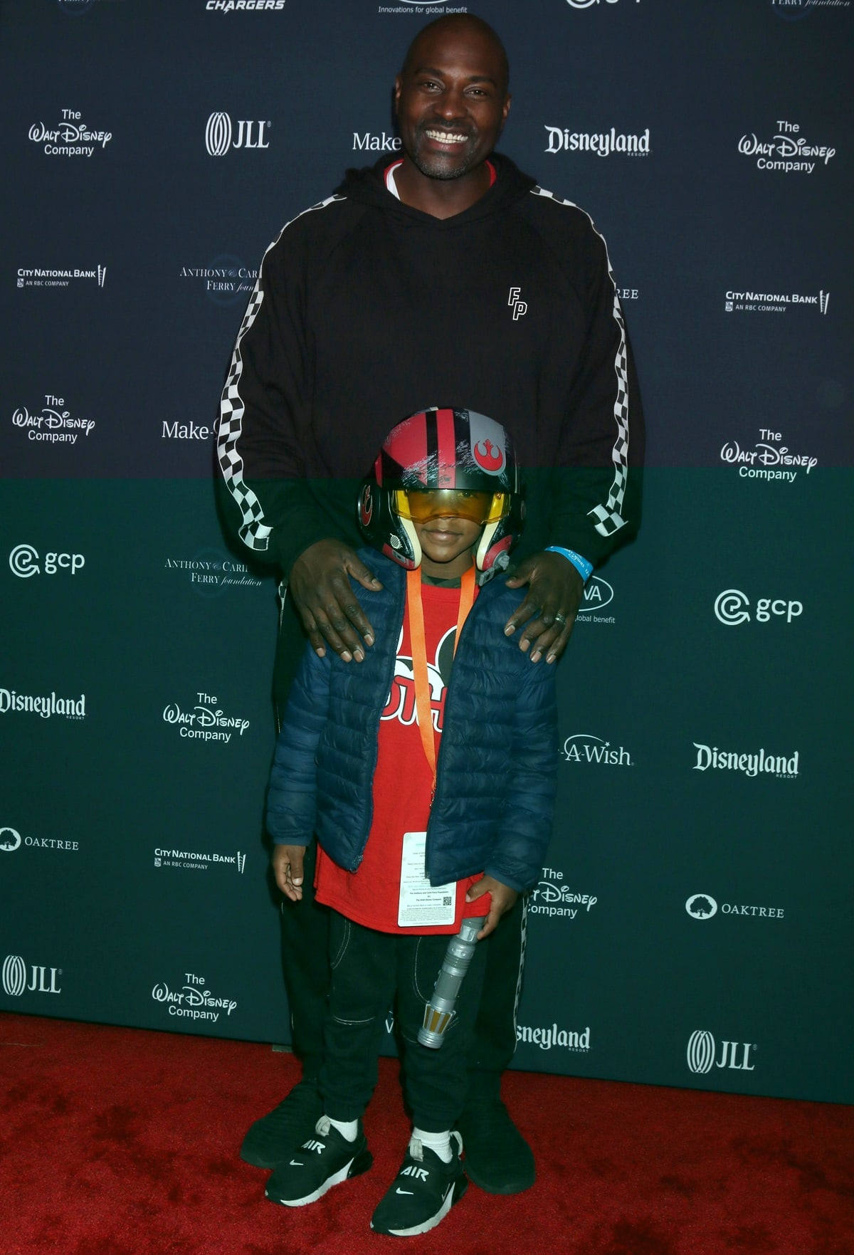 Marcellus Wiley is pictured alongside his son, Marcellus Wiley Jr., attending the 2021 Galaxy Of Wishes event held at Disneyland Park on December 7, 2021, in Anaheim, California