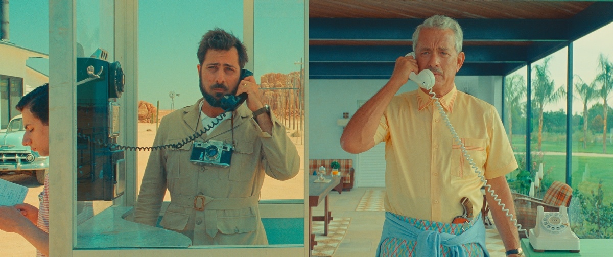 Jason Schwartzman as Augie Steenbeck and Tom Hanks as Stanley Zak in the 2023 comedy-drama film Asteroid City
