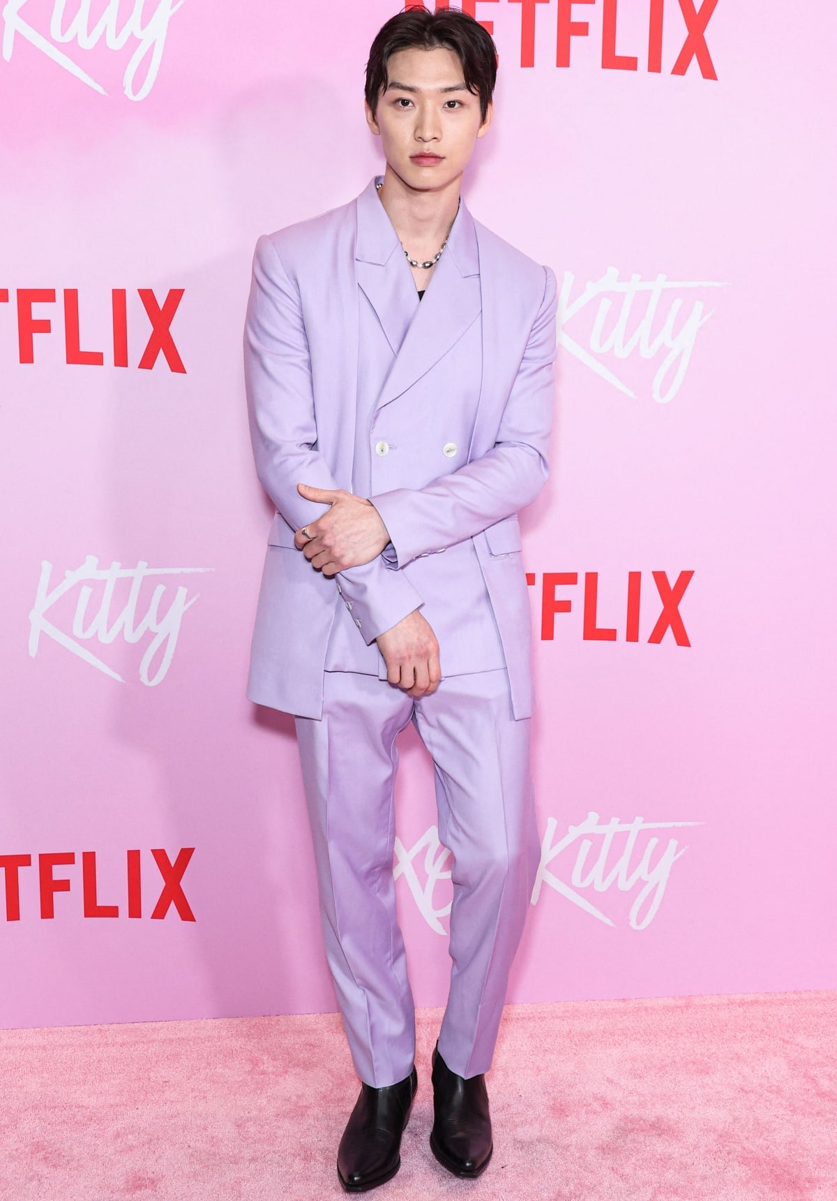 Sang Heon Lee in a lavender suit at the Los Angeles premiere event of Netflix’s XO, Kitty Season 1