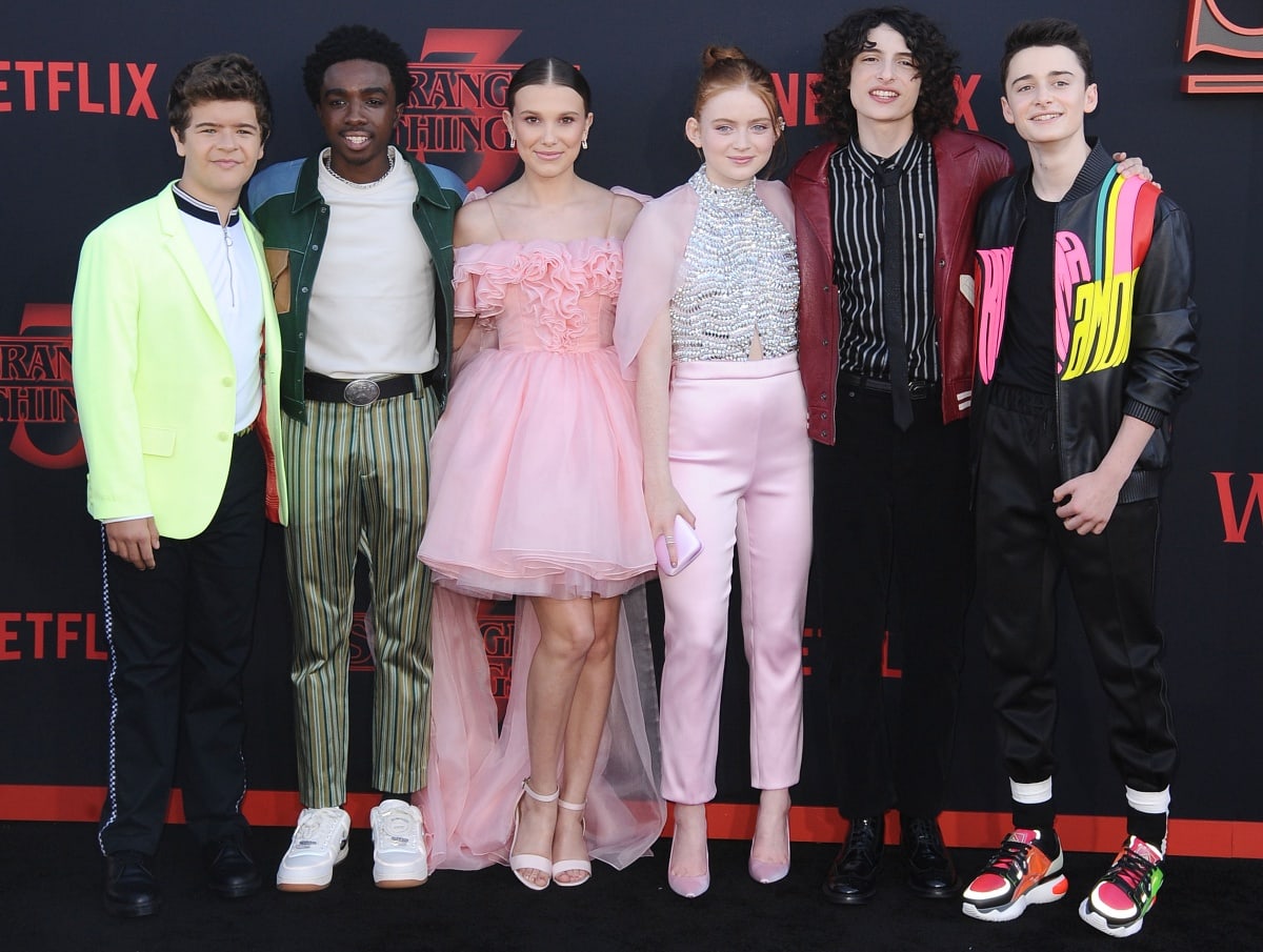 The cast of Stranger Things—Gaten Matarazzo, Caleb McLaughlin, Millie Bobby Brown, Sadie Sink, Finn Wolfhard, and Noah Schnapp—stun in stylish outfits at the Season 3 premiere