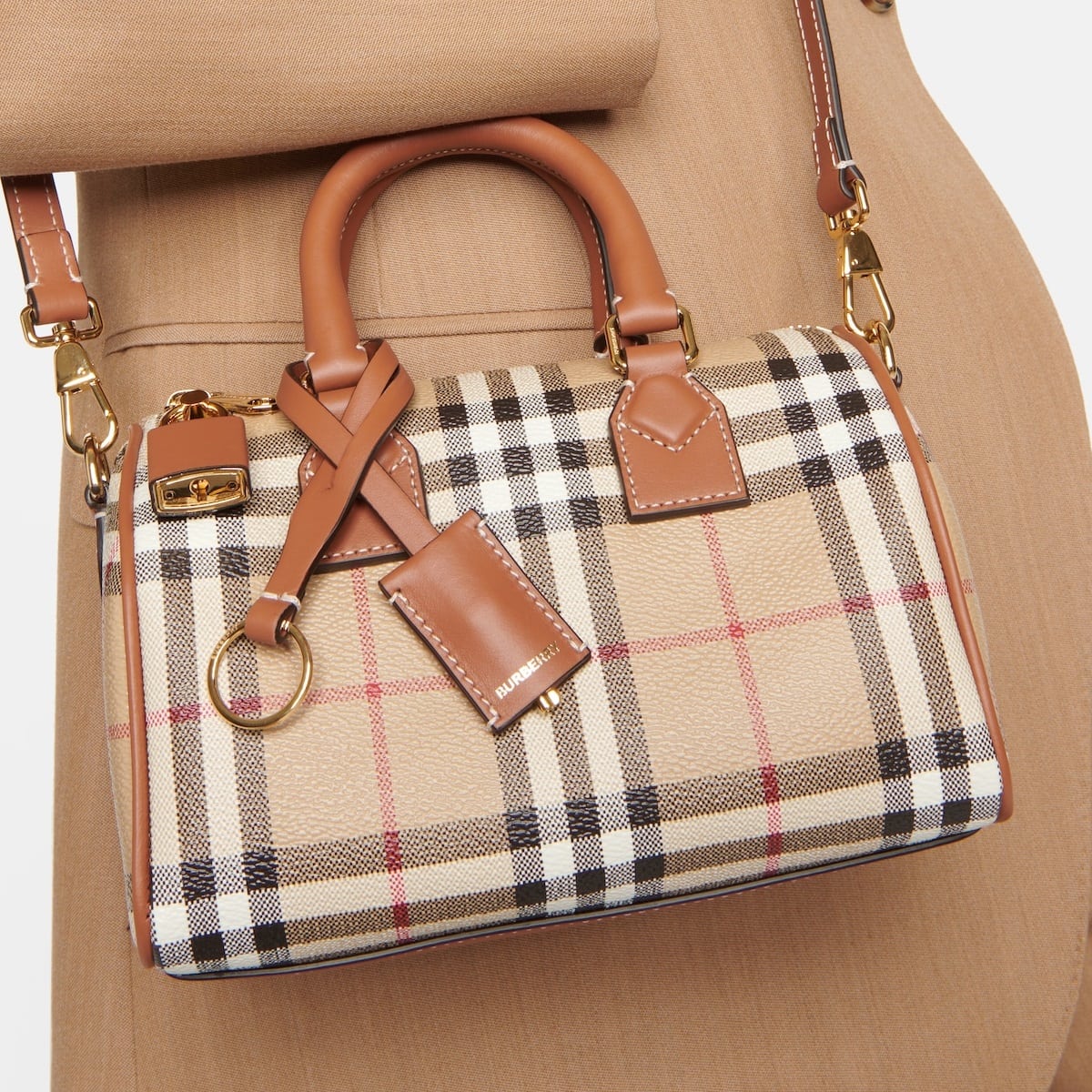 Authentic Burberry bags feature an iconic check pattern, either on the lining or exterior, that is evenly spaced and always sharp, never blurry or faded