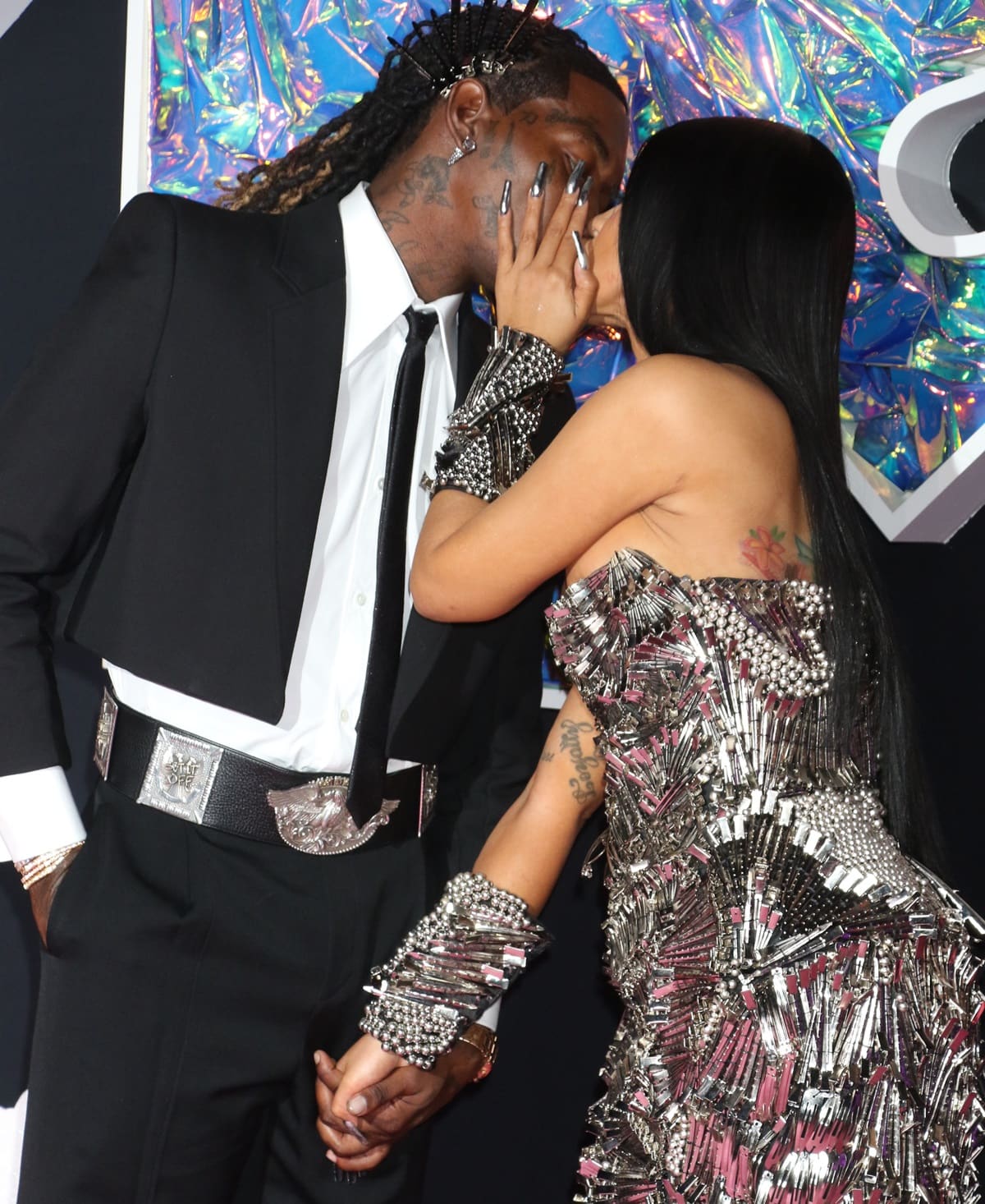 In a subtle nod to Cardi B's ensemble, Offset sported hair clips in his hairstyle, striking the perfect balance between complementing her look and maintaining his distinct style