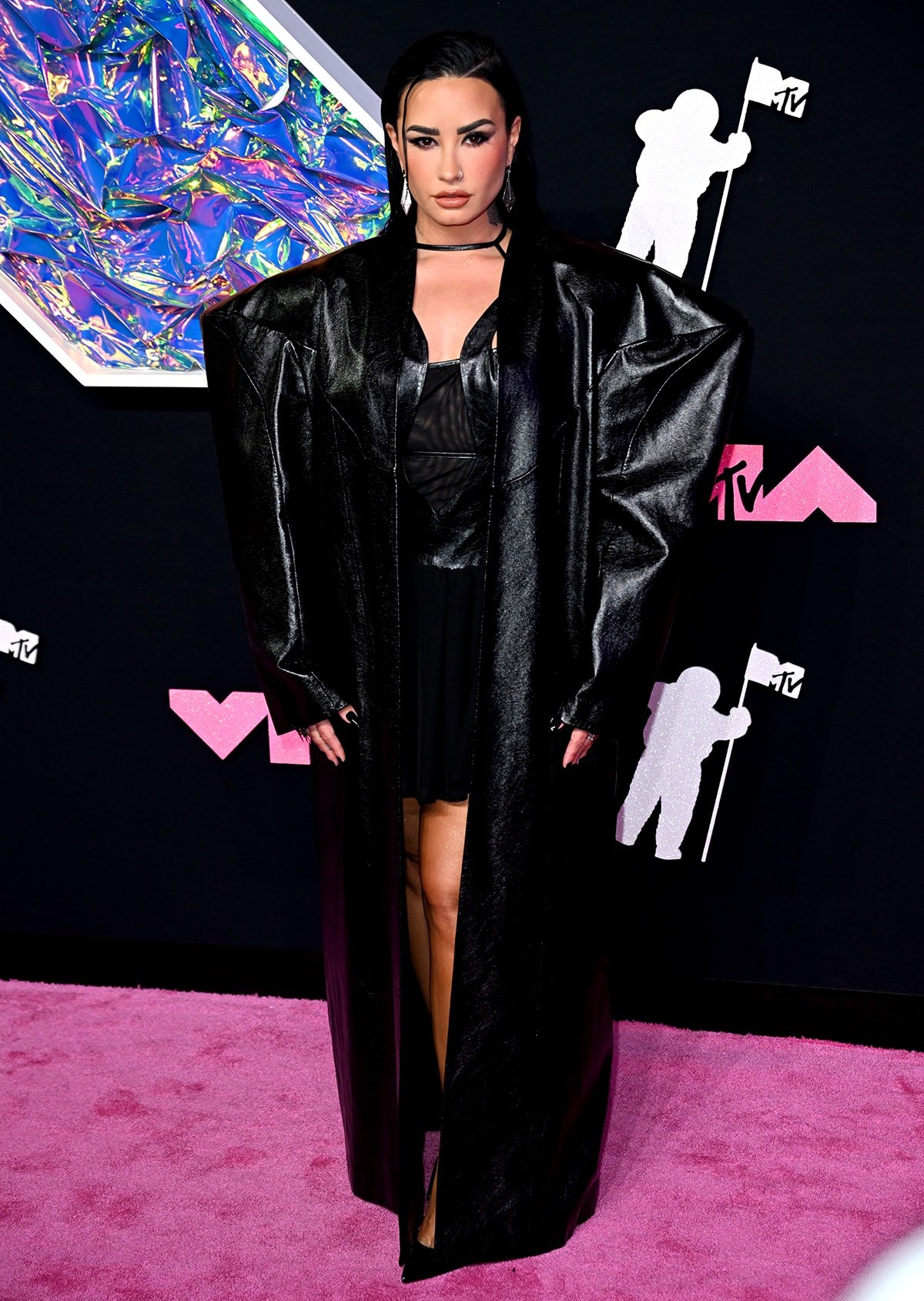Demi Lovato channels her inner rock goddess in Buerlangma LBD and massive overcoat with structural boxy shoulders