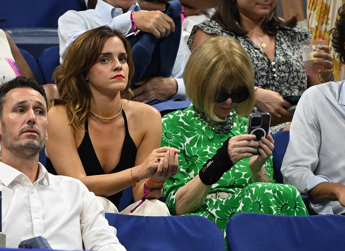 Emma Watson watches the 2023 US Open with Anna Wintour in a black Khaite halter top and a pair of white pants