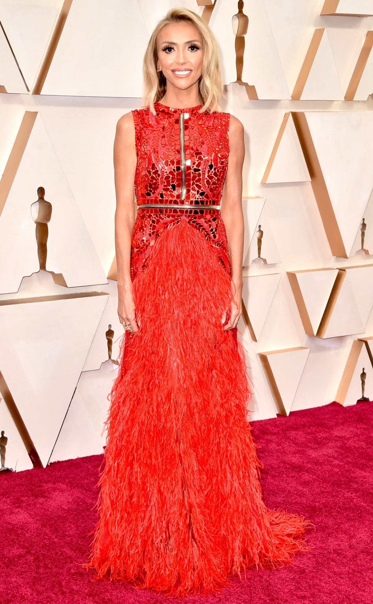 Giuliana Rancic stood tall at 5 feet 8 inches (172.7 cm) while wearing a dazzling sleeveless dress by Atelier Zuhra at the 92nd Annual Academy Awards