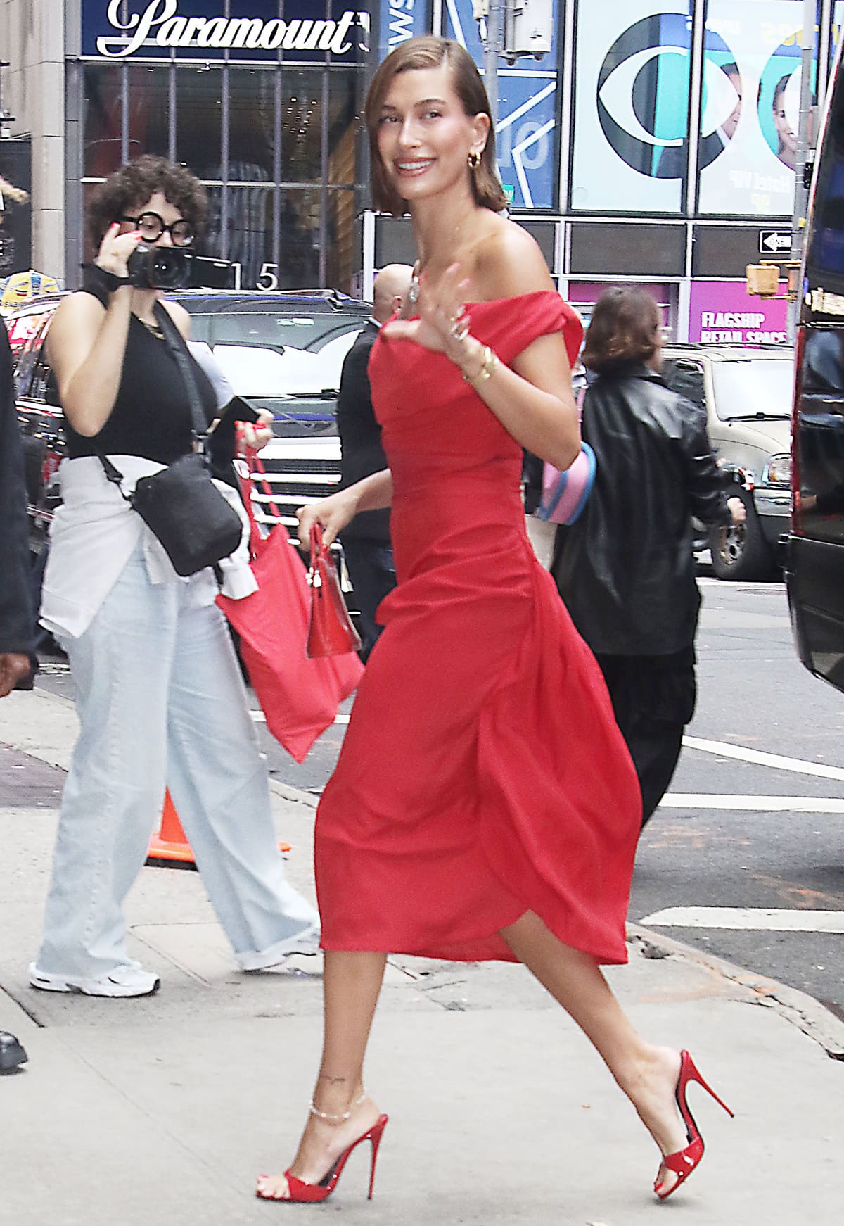 Hailey Bieber promoting her new limited-edition Rhode strawberry glaze peptide lip treatment on Good Morning America on August 28, 2023