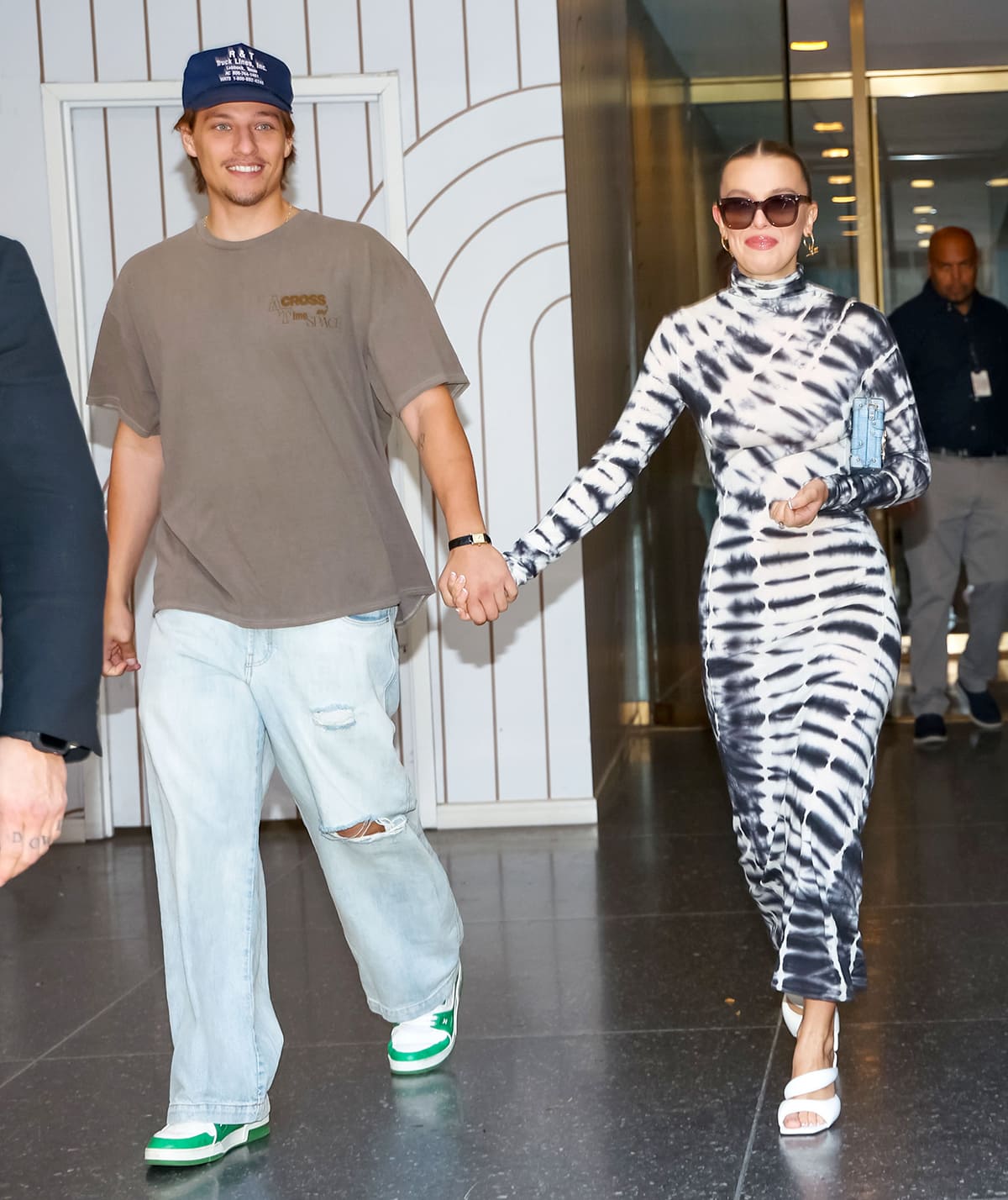Jake Bongiovi and Millie Bobby Brown leaving the Today Show in New York City after discussing her debut novel Nineteen Steps on September 14, 2023