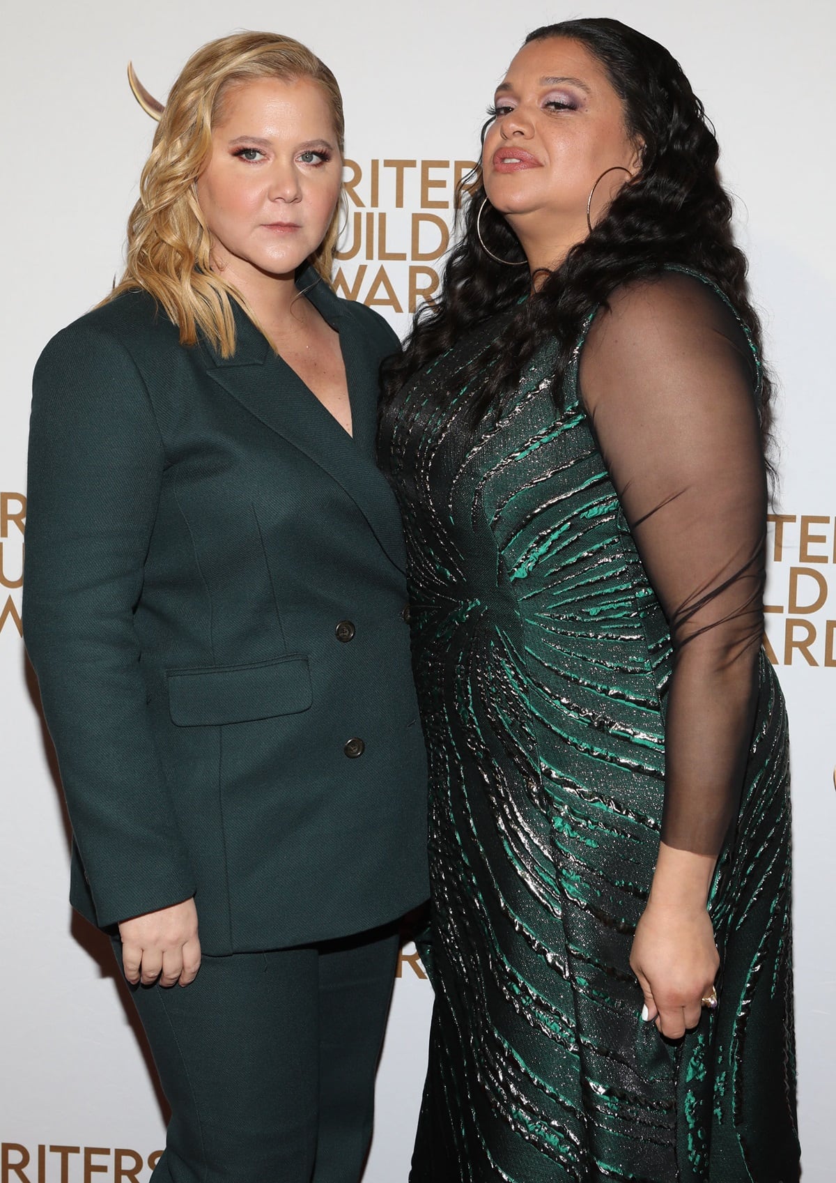 Michelle Buteau and Amy Schumer, both standing at 5′ 7″ (1.70 m), attended the 75th Annual Writers Guild Awards