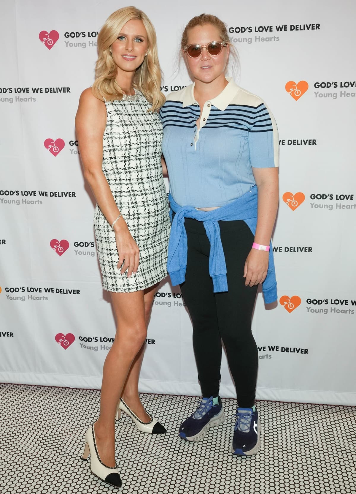 Although both Nicky Rothschild and Amy Schumer are 5′ 7″ (1.70 m), Nicky appeared taller when wearing heels at The Museum Of Ice Cream's Inaugural Young Hearts Friends Fest Ice Cream Social
