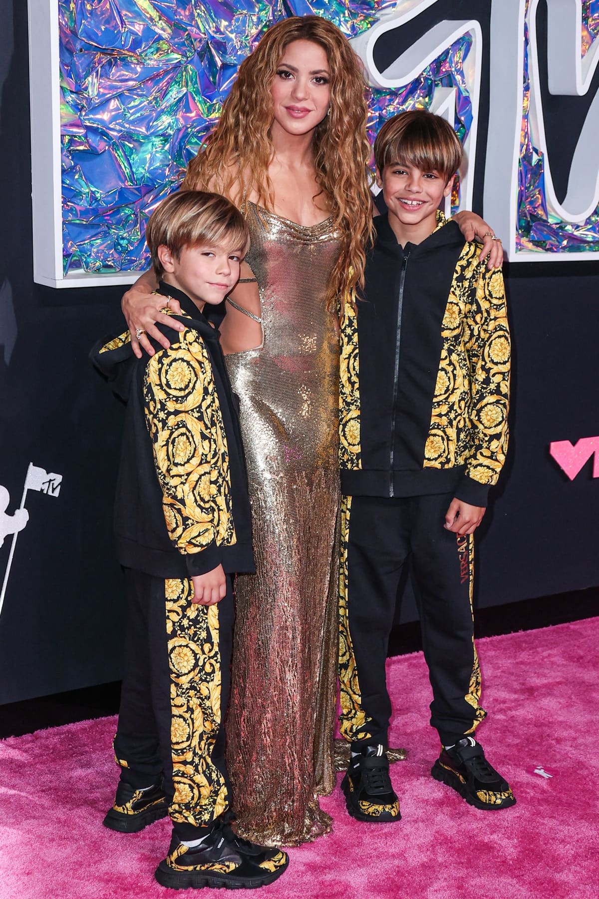 Shakira's two sons, Milan and Sasha, looked stylish and comfortable in their matching black-and-yellow Versace sweatsuits