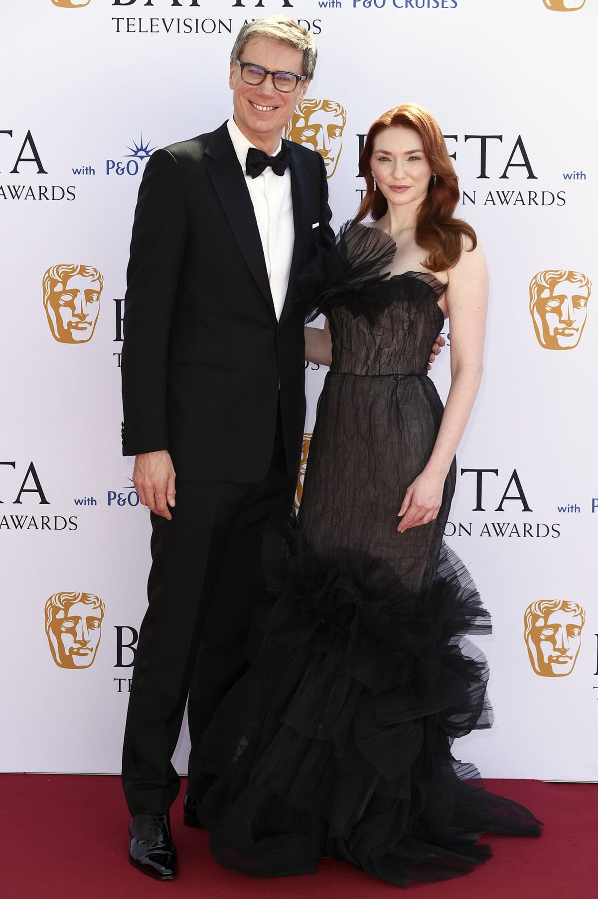 Standing beside her The Outlaws co-star Stephen Merchant—who towers at 6ft 7 (200.7 cm)—Eleanor Tomlinson appeared especially petite, despite the added height from her heels and voluminous Marchesa gown during the 2024 BAFTA Television Awards with P&O Cruises at The Royal Festival Hall on May 12, 2024, in London, England