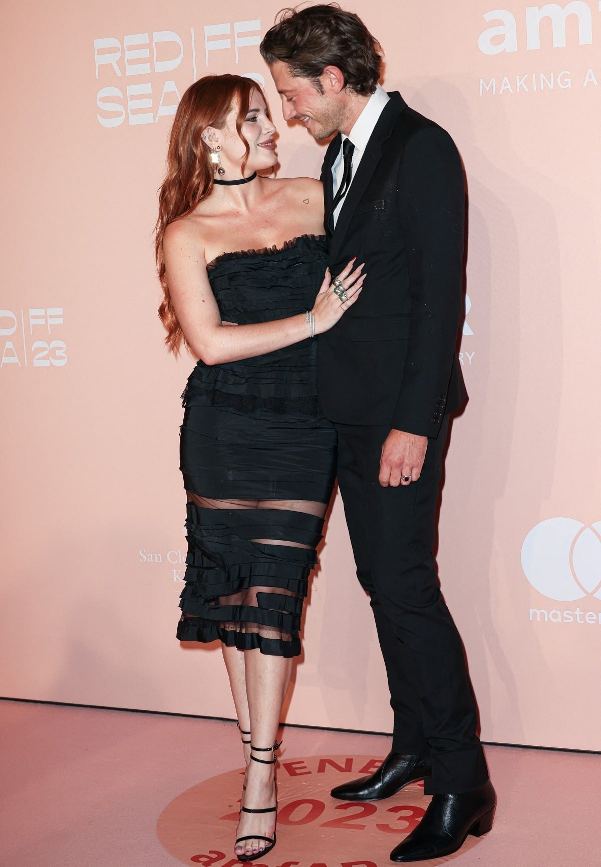 Bella Thorne and fiancé Mark Emms looking all loved up at the amfAR Gala
