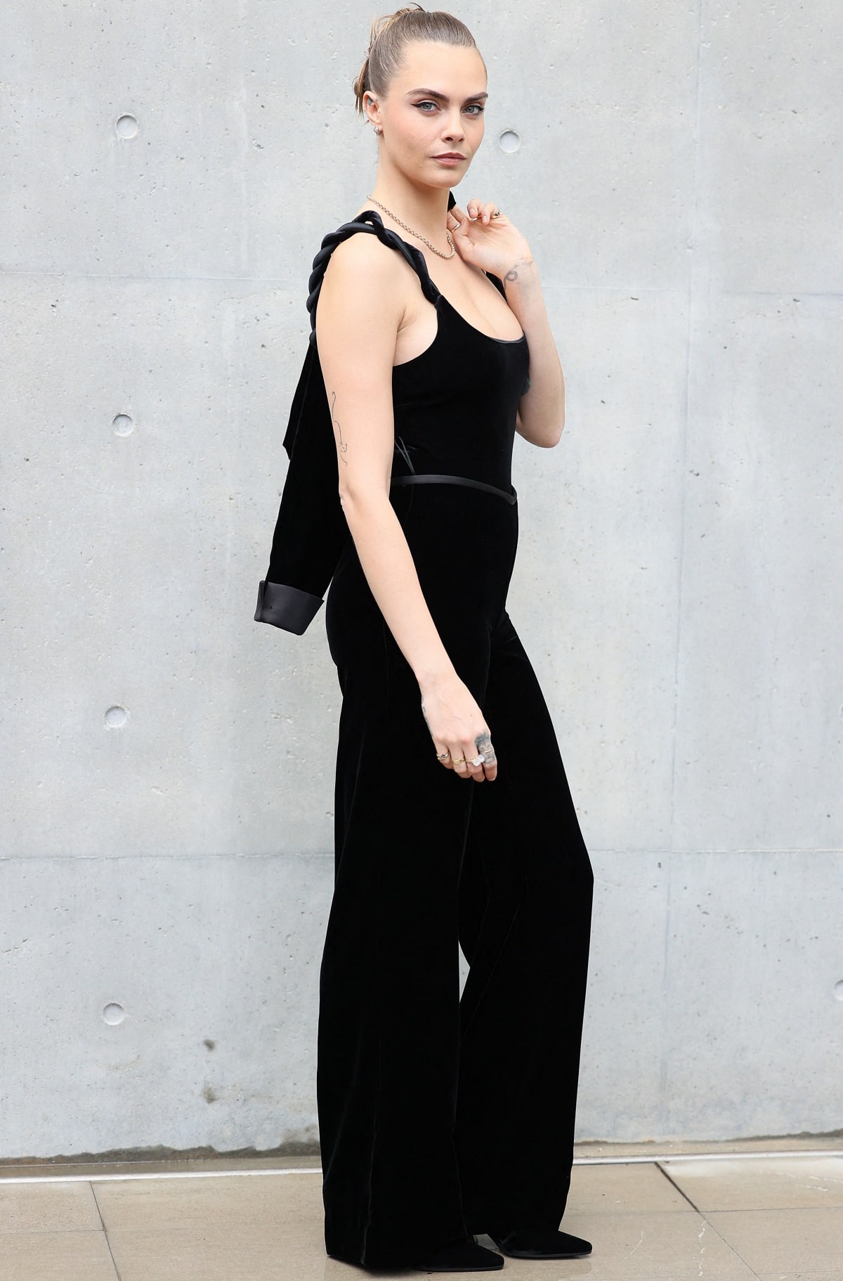 Cara Delevingne showing off her impeccable style with an edgy all-black ensemble that flaunted her enviable physique at the Emporio Armani Spring/Summer 2024 runway show during Milan Fashion Week