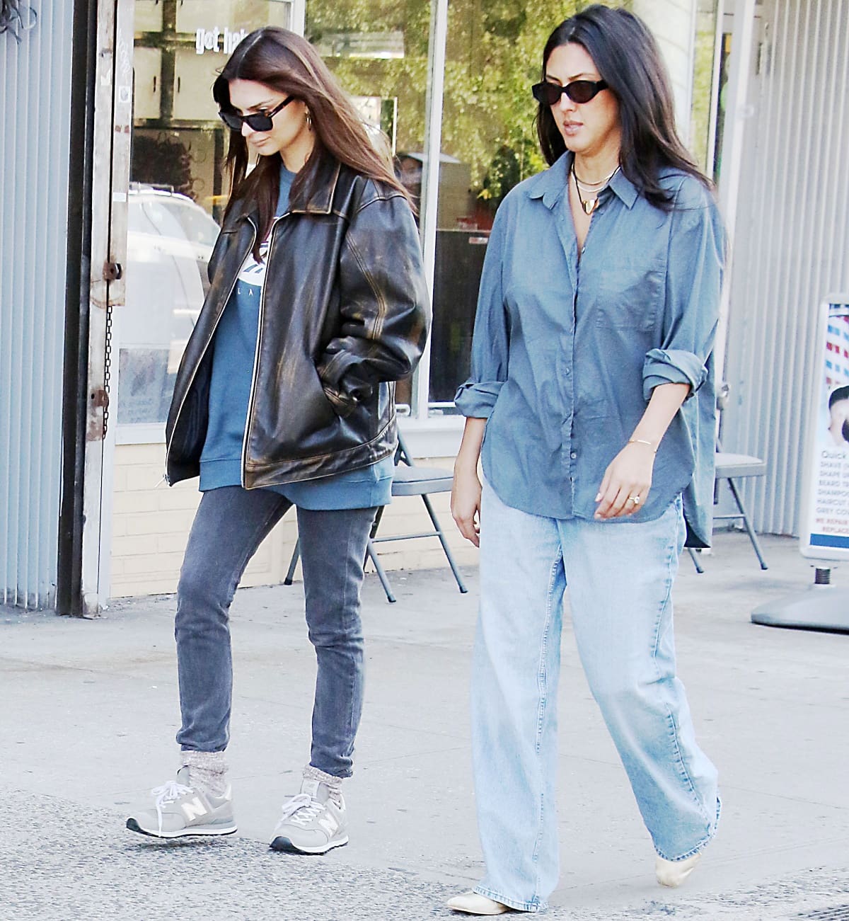 Emily Ratajkowski wearing New Balance 574 sneakers with fuzzy white-and-purple socks