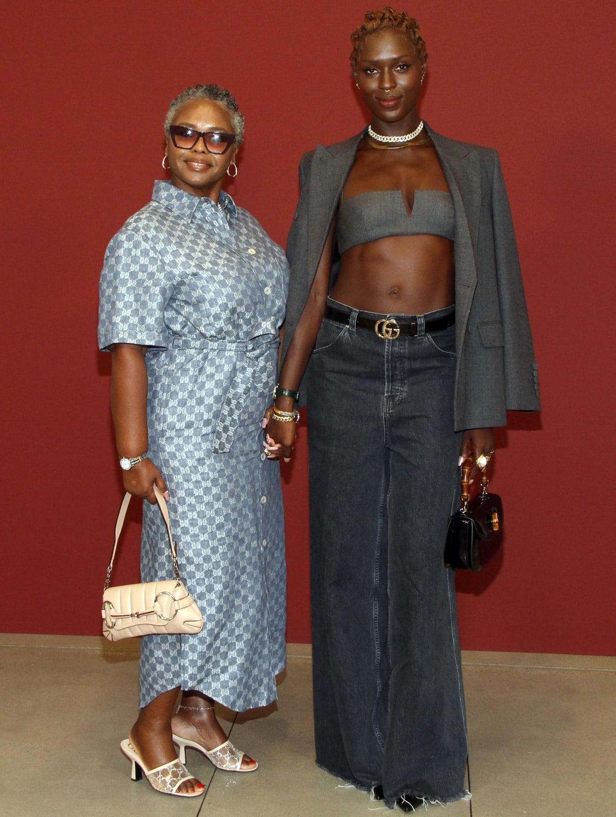 Not to be outdone by her stylish daughter, Hilda Smith stepped out in a Gucci ensemble that consisted of a blue checkered shirt dress, white heels, and a Horsebit Chain shoulder bag