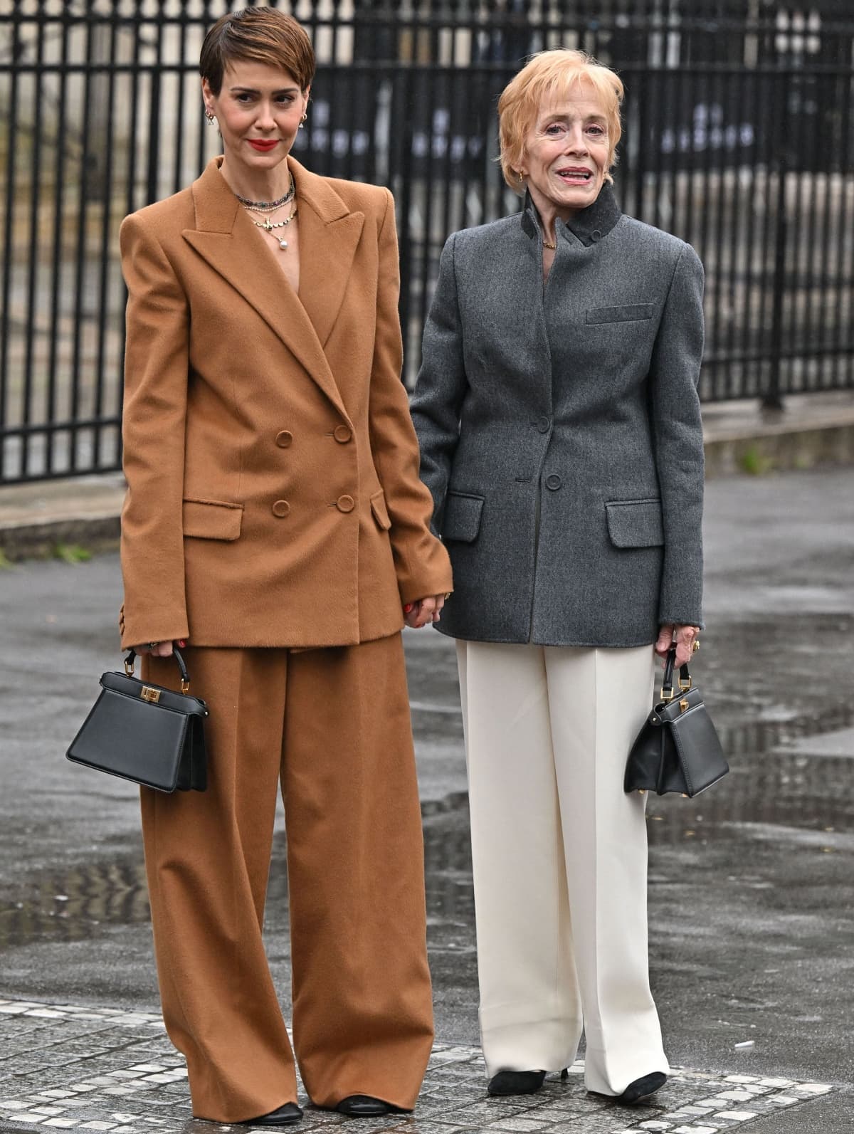 Holland Taylor (pictured with partner Sarah Paulson on the left) played Evelyn Harper and has a net worth of $12 million