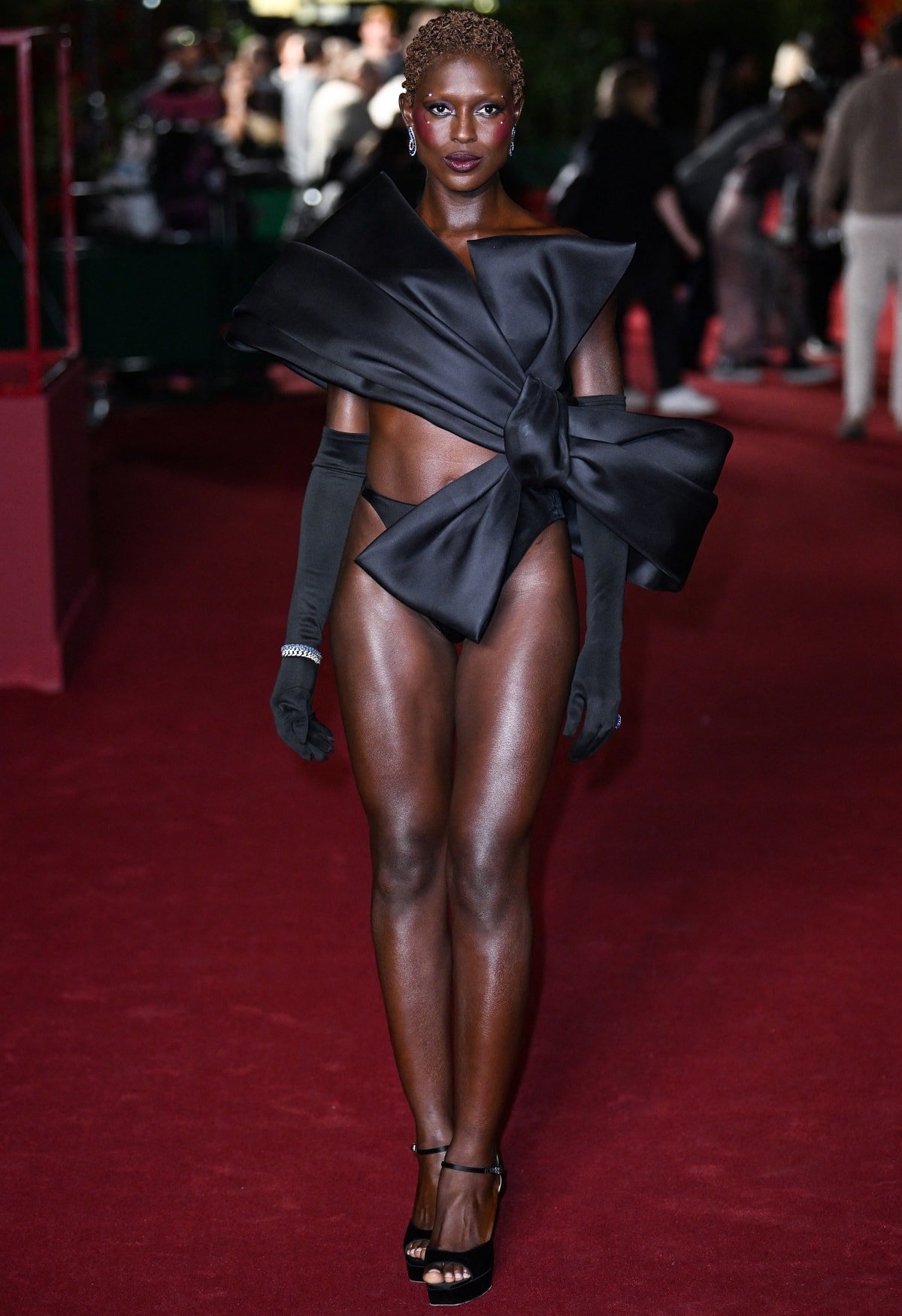 Jodie Turner-Smith making a bold fashion statement in Viktor & Rolf Fall 2023 Haute Couture and Rene Caovilla Anastasia platform heels