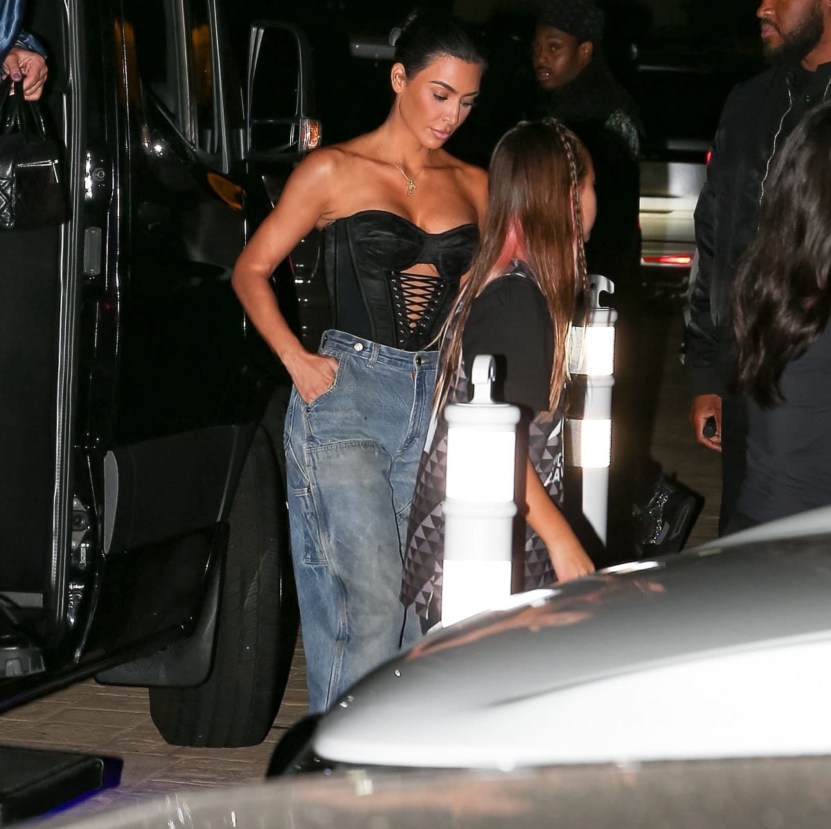 Kim Kardashian changed into a black strapless top with corset details for dinner