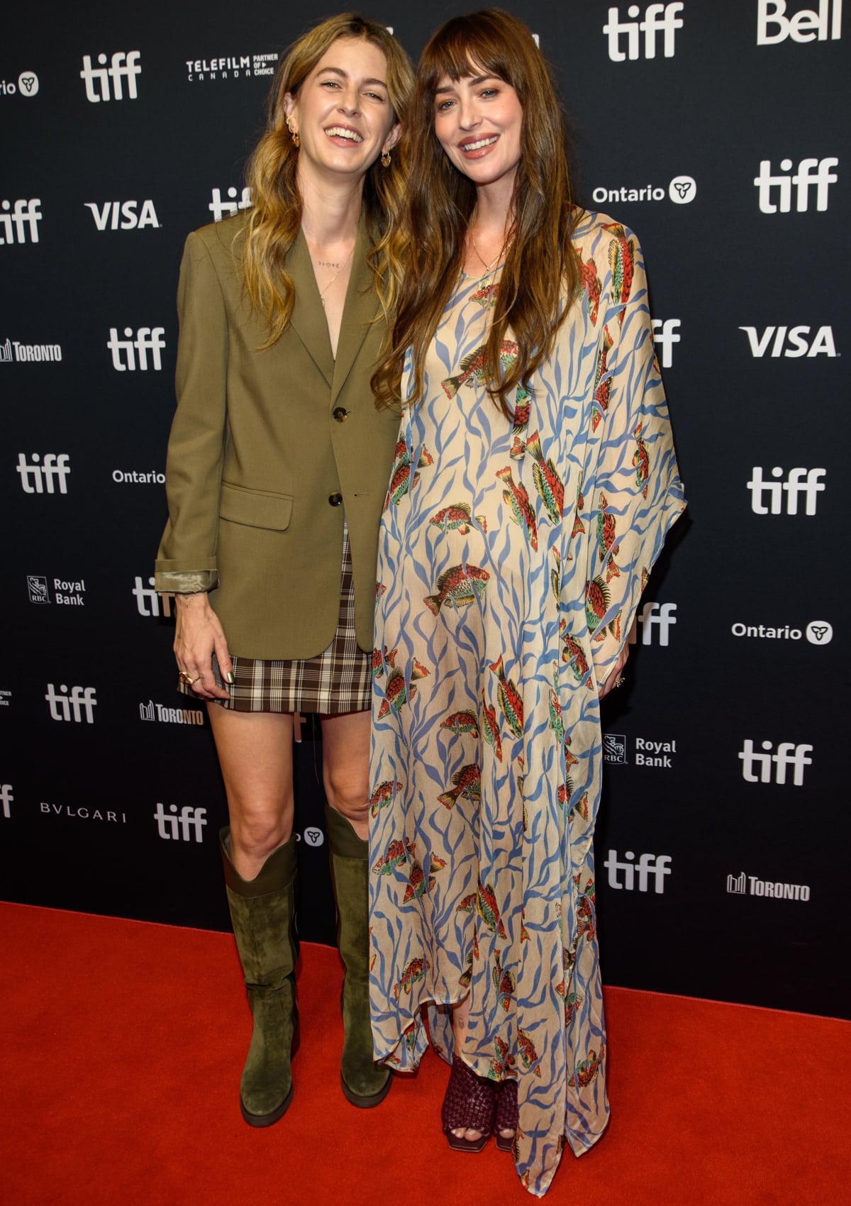 Dakota Johnson with Ro Donnelly at the Daddio premiere during the 48th Toronto International Film Festival