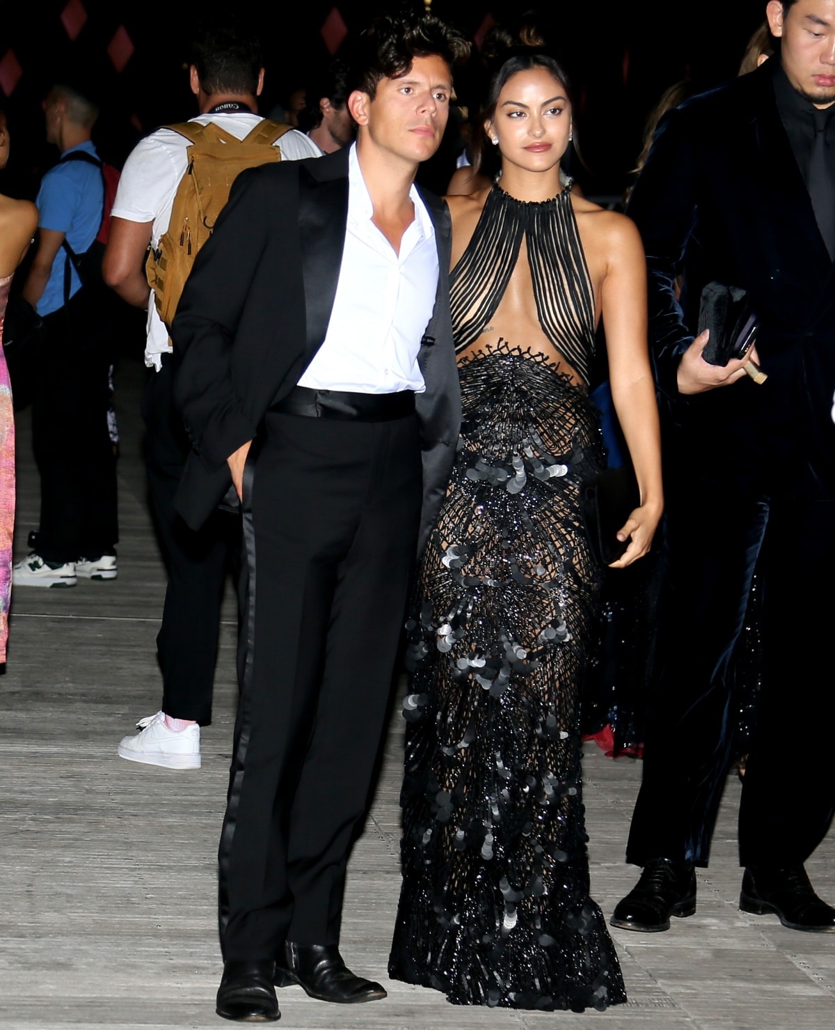 Camila Mendes with boyfriend Rudy Mancuso in matching black ensembles at Giorgio Armani’s “One Night Only” fashion show