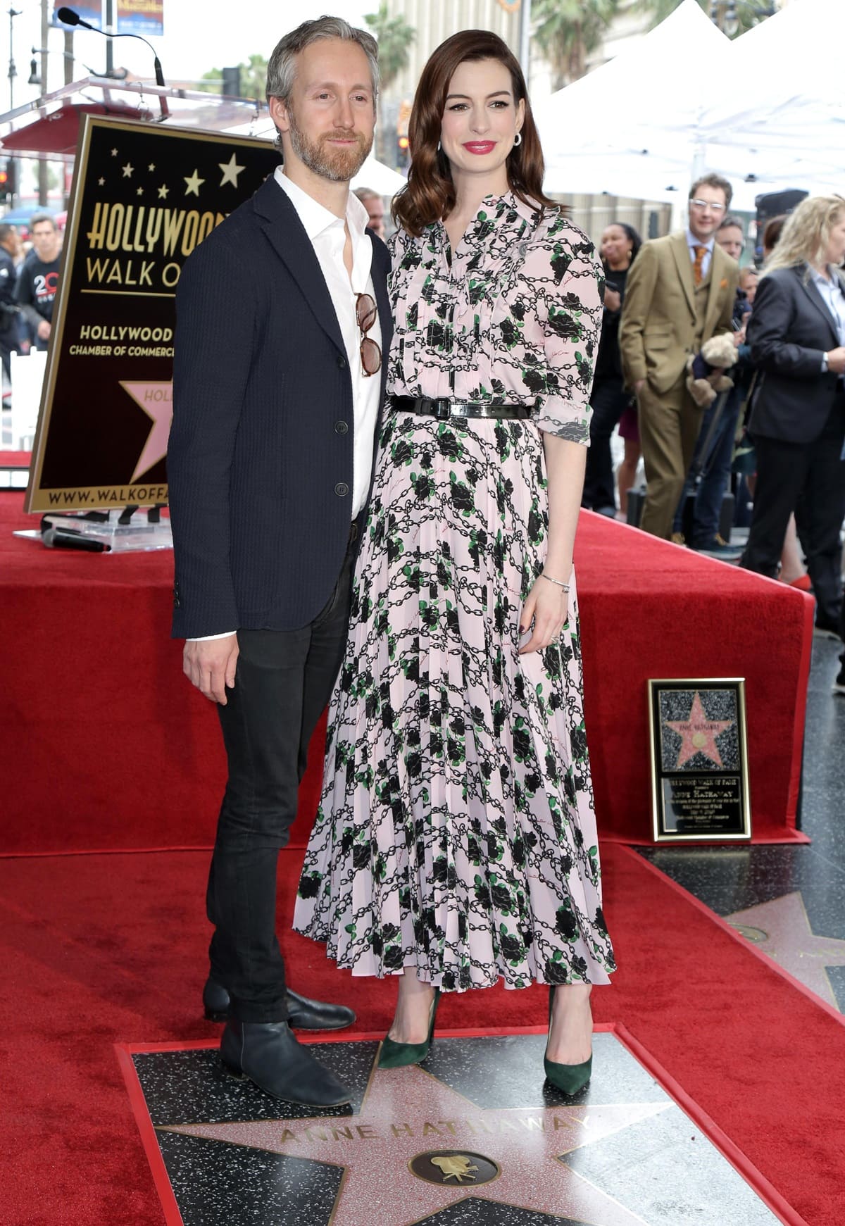 Anne Hathaway, wearing heels and appearing the same height as Adam Shulman, attended the ceremony honoring her with a star on the Hollywood Walk of Fame on May 9, 2019, in Hollywood, California