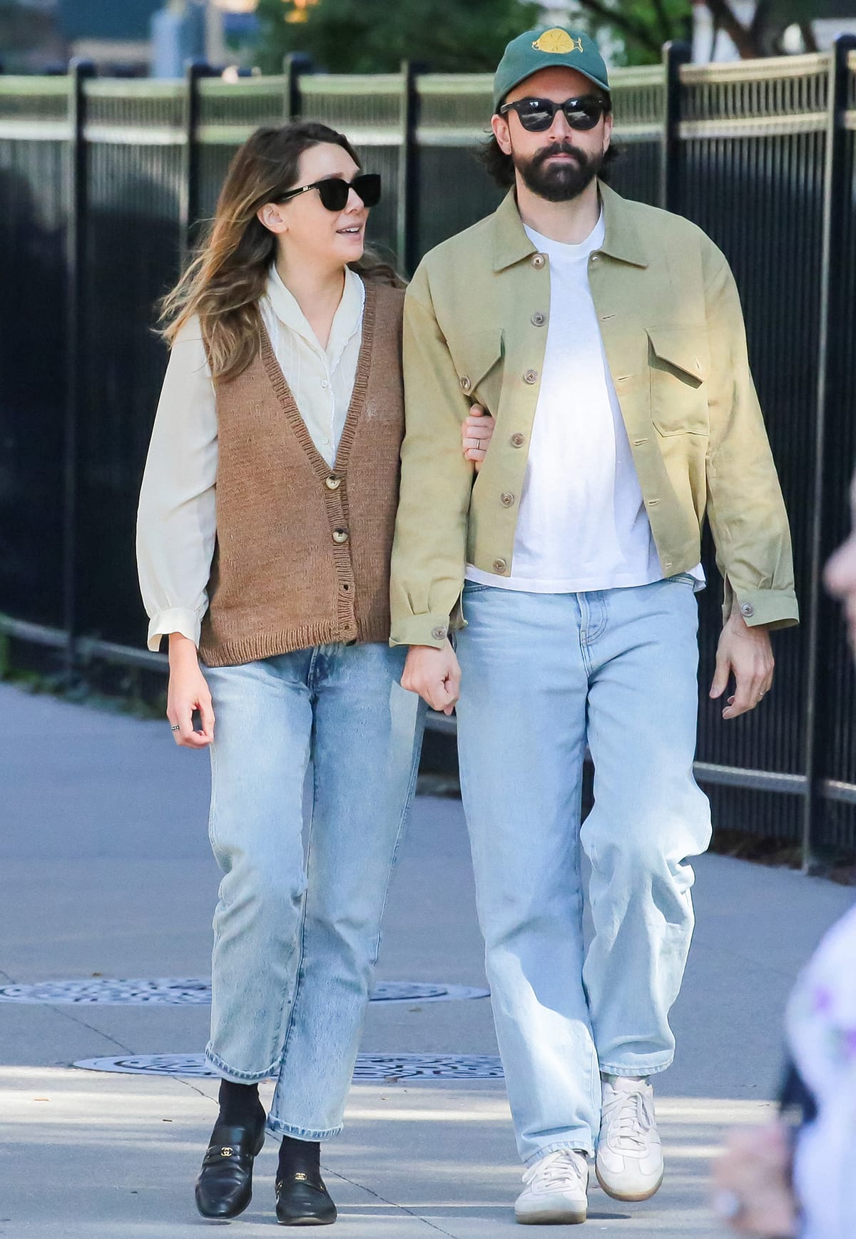 Robbie Arnett coordinates with Olsen in a white tee, khaki jacket, and light-washed jeans