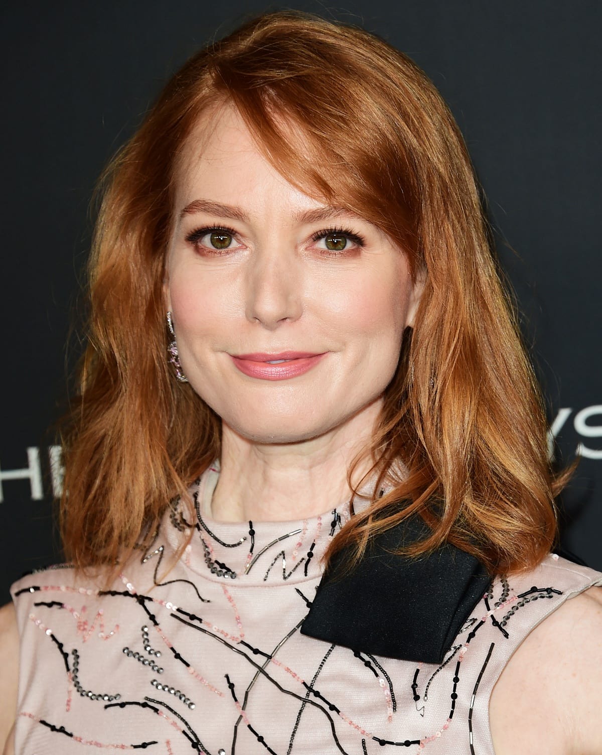 Alicia Witt is an American actress, who is known for her roles in TV shows like The Walking Dead, Justified, and Nashville, as well as Hallmark Christmas films like Our Christmas Love Song, Christmas Tree Lane, and The Mistletoe Inn