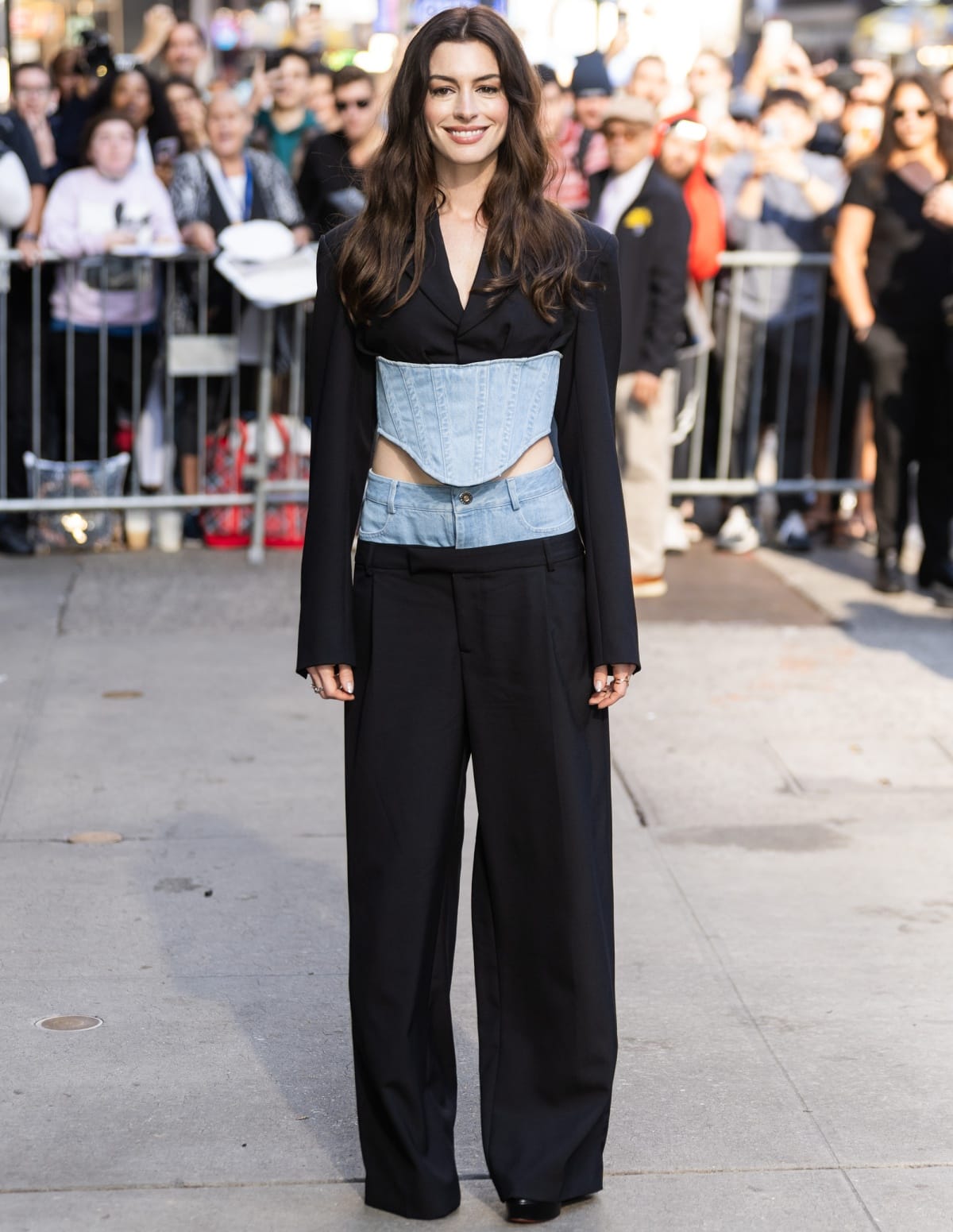 Anne Hathaway posing for photographs outside the Good Morning America studios