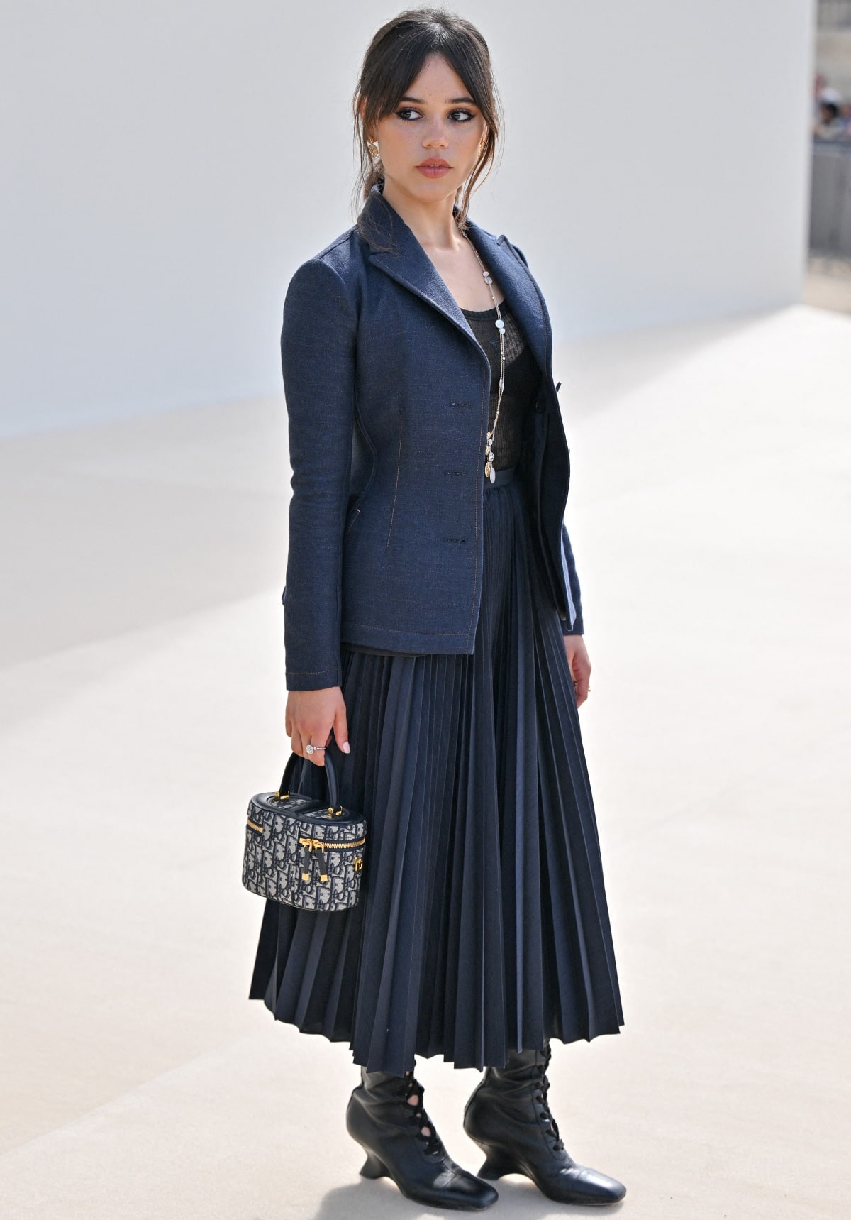 Jenna Ortega wearing a Resort 2024 look from Christian Dior that exuded a business goth aesthetic
