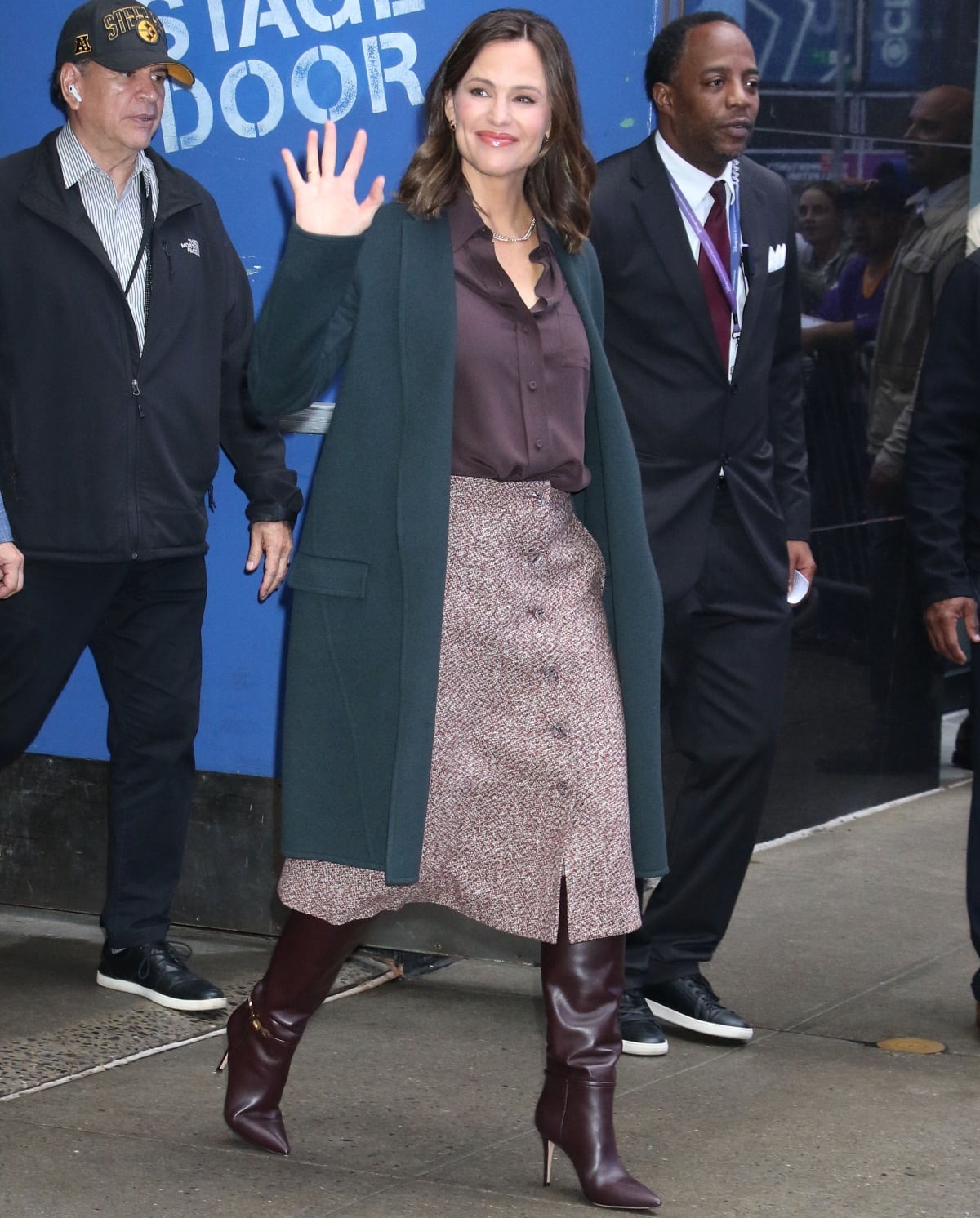 Jennifer Garner changing into a teal jacket with a brown buttoned blouse and a matching boucle buttoned skirt before leaving the Good Morning America studio