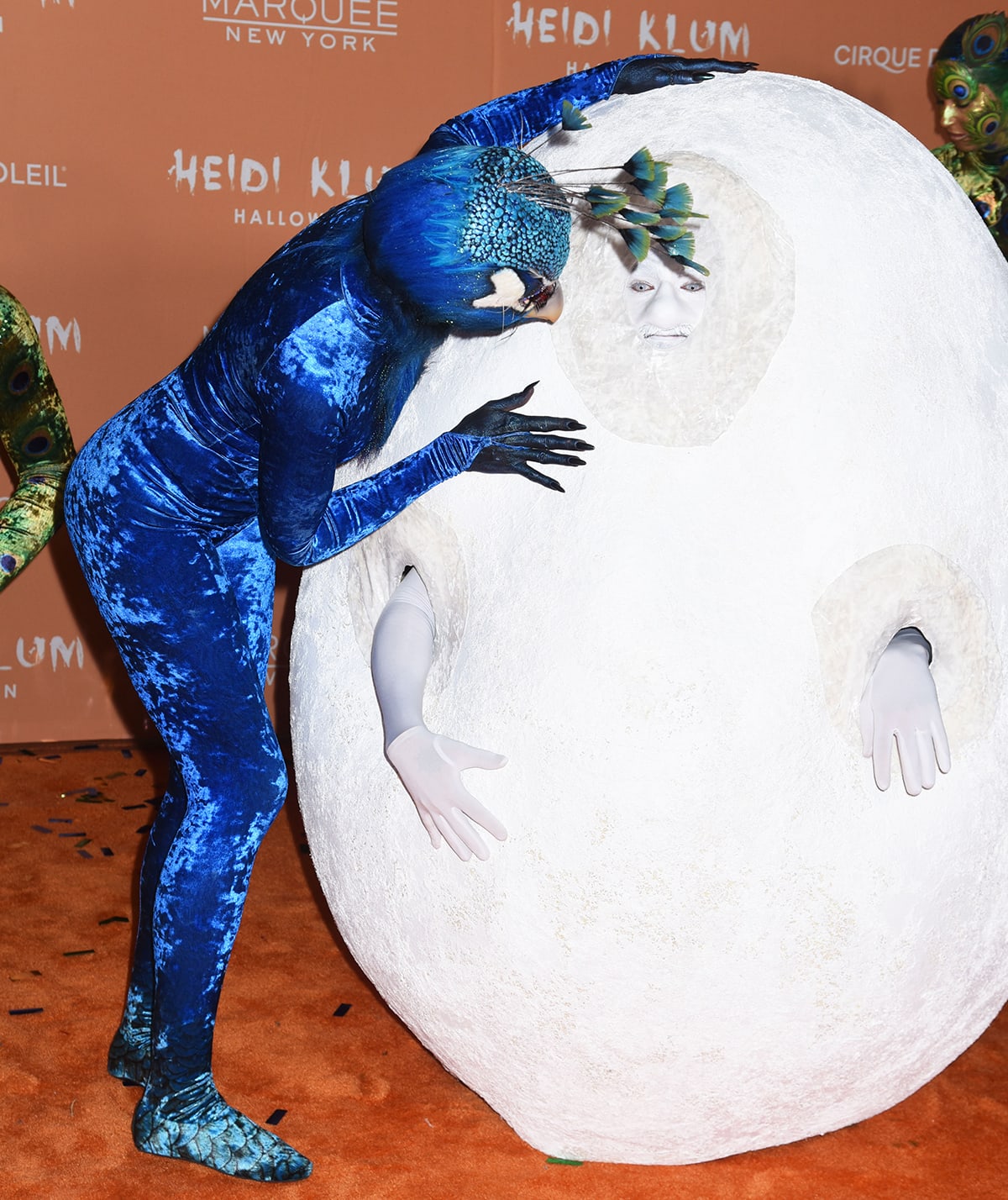 Heidi Klum's husband Tom Kaulitz shows up as Klum's human-sized peacock egg