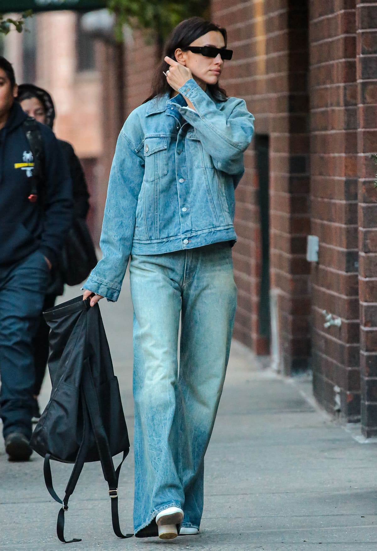 Irina Shayk embraces the double denim trend while strolling around New York City on November 3, 2023