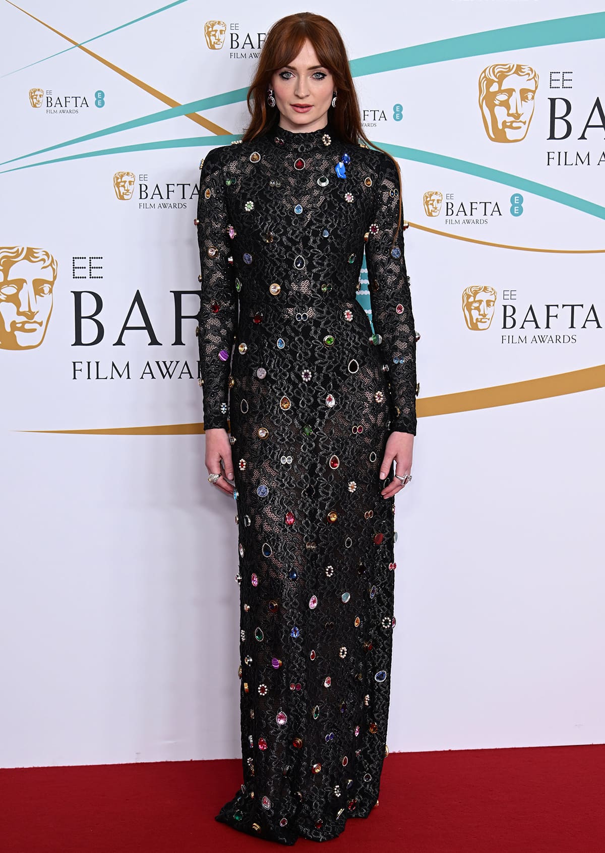 Sophie Turner, pictured at the British Academy Film Awards 2023, is said to be taking things slow and keeping her options open following her PDA with Peregrine Pearson