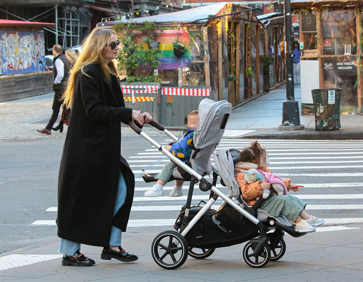 Sophie Turner spends time with her two daughters in jeans, coat, and loafers on November 3, 2023