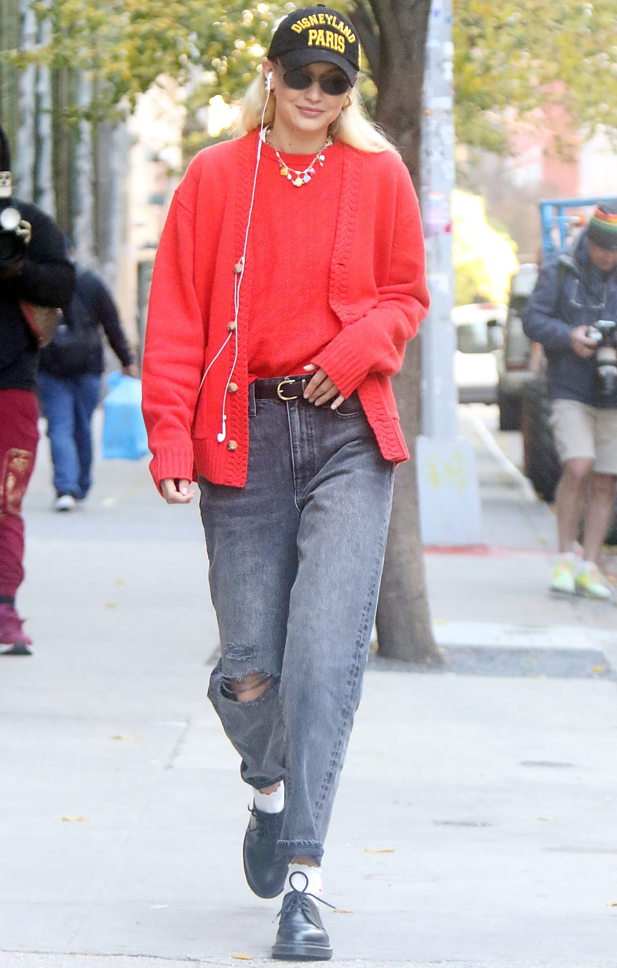Gigi Hadid was difficult to miss in a vibrant red Guest in Residence cardigan while out and about in New York City