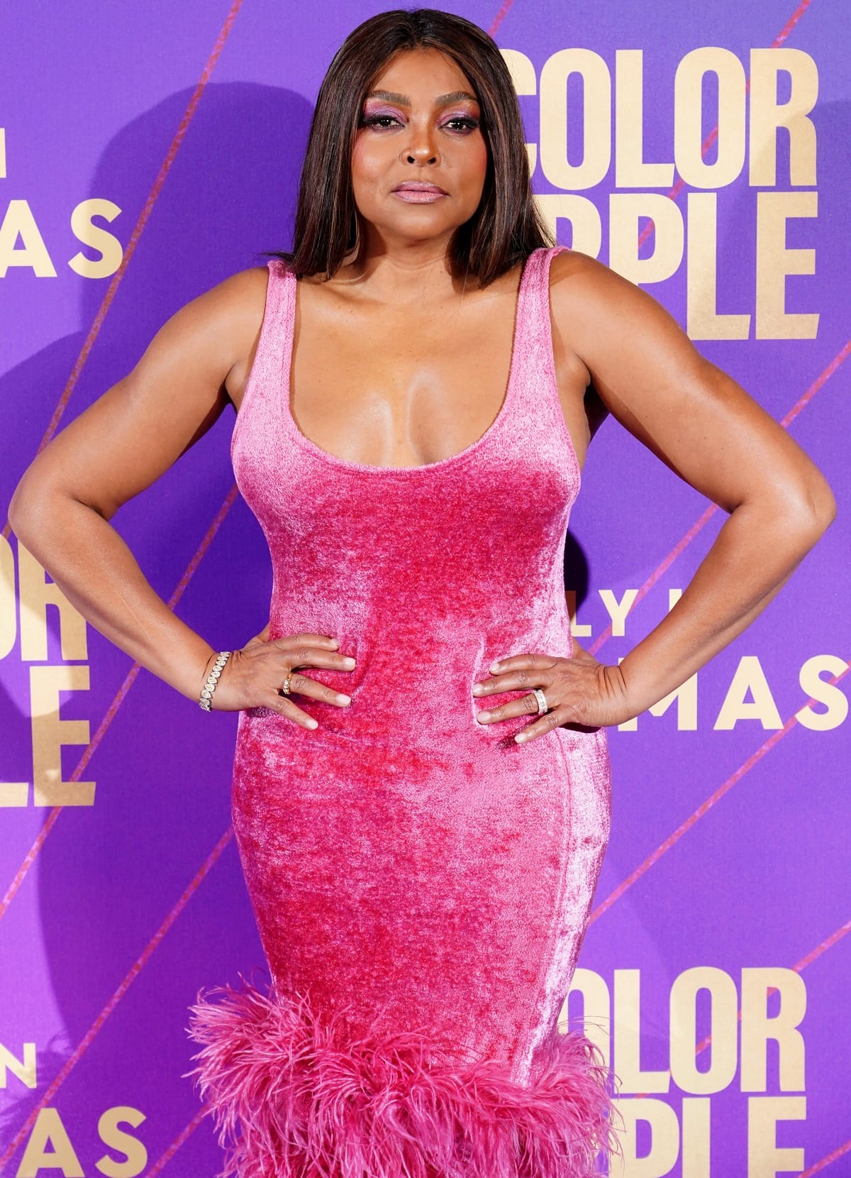 Taraji P. Henson’s beauty look consisted of dramatic pink and purple eye makeup, pink gloss, and sleek, straight hair